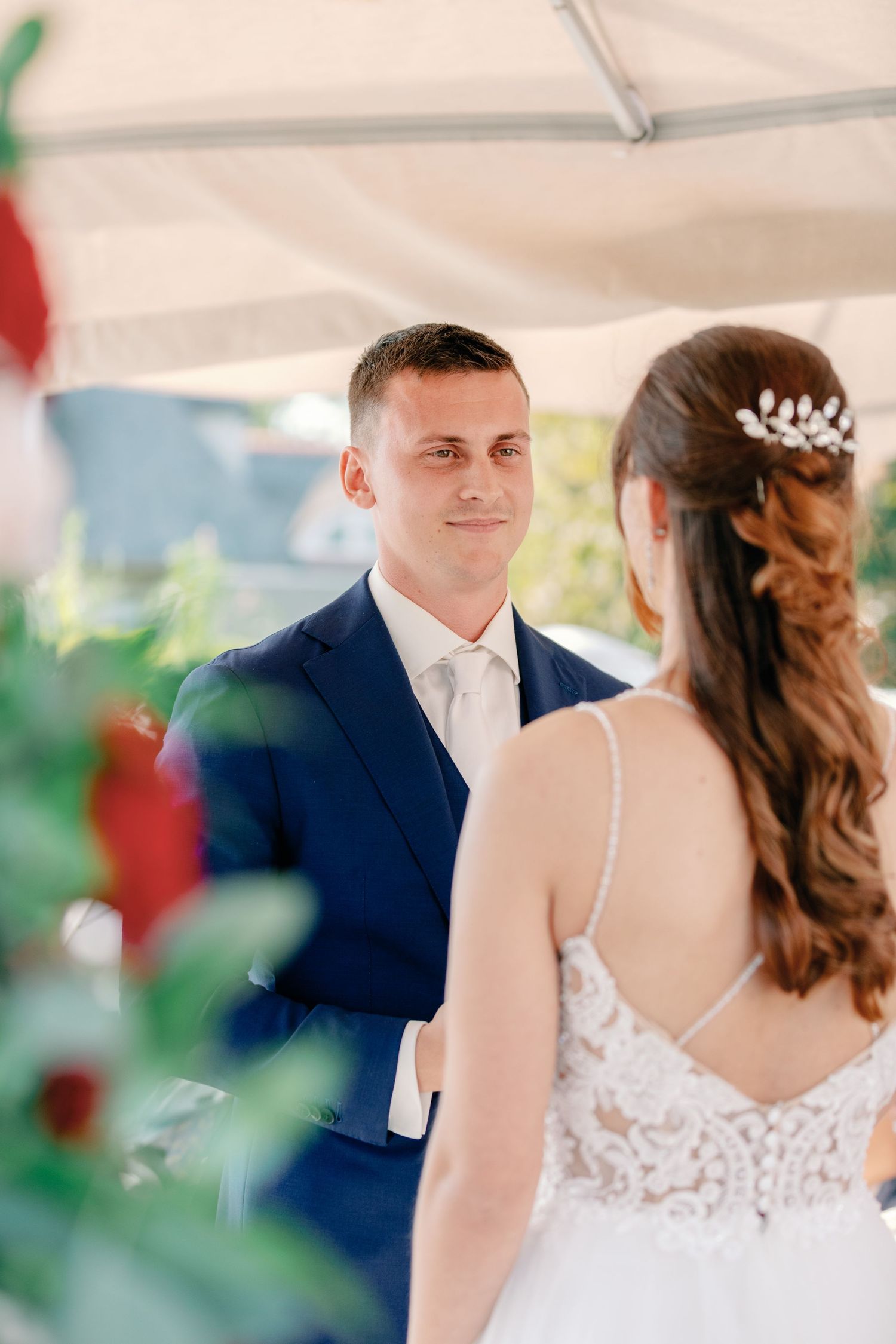 A couple shares intimate moments during their outdoor wedding celebration.
