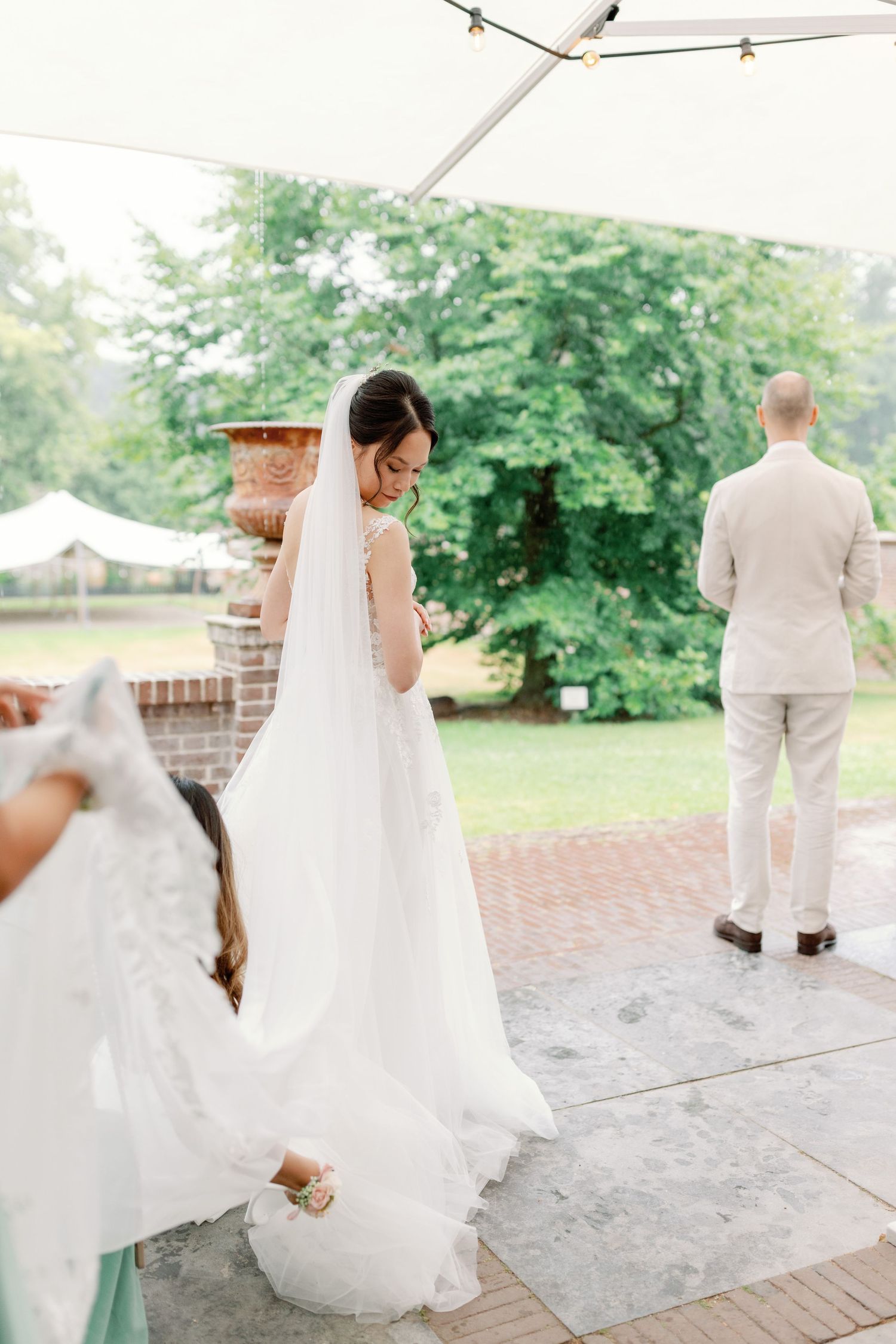 A series of wedding photos showing the first look moment between a bride and groom on a brick patio.