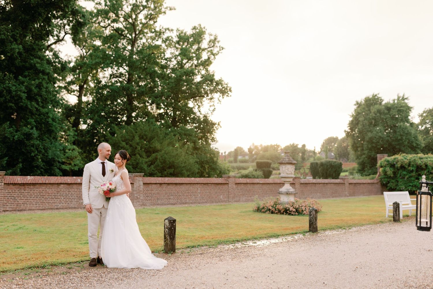 Wedding celebration on a scenic stone terrace overlooking rolling countryside.