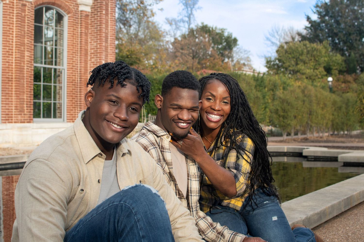 Friends bonding and sharing joyful moments together on a college campus.