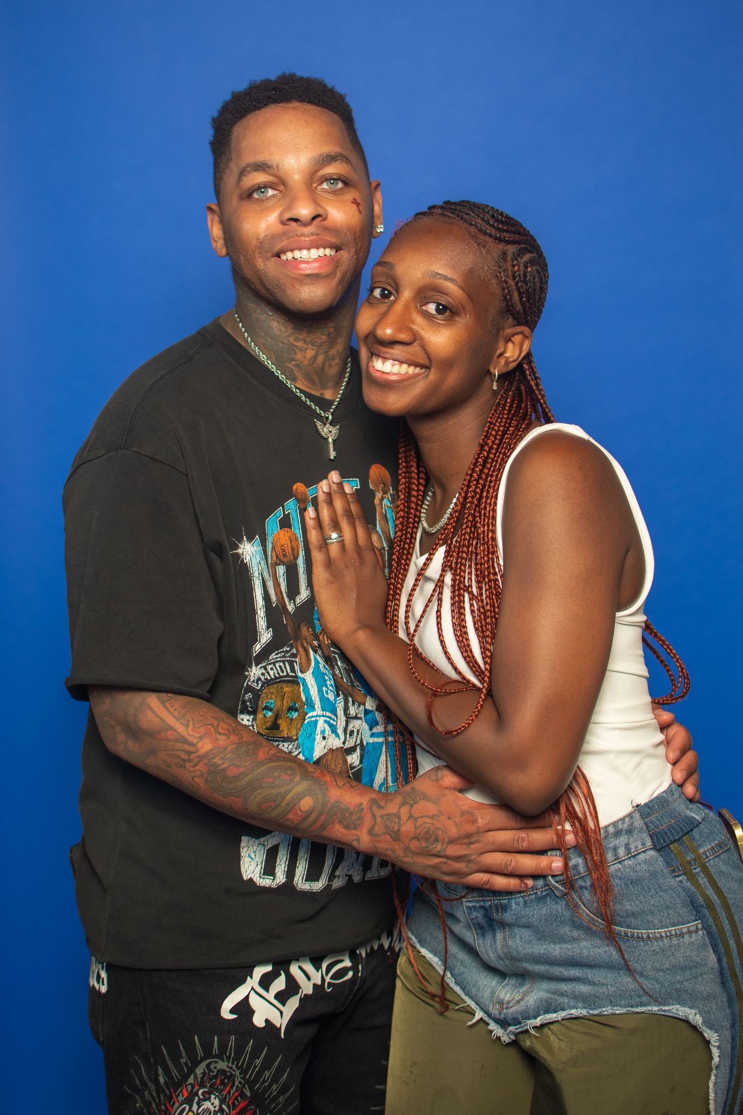 A series of five candid photos against a blue backdrop showing a couple embracing and laughing together.