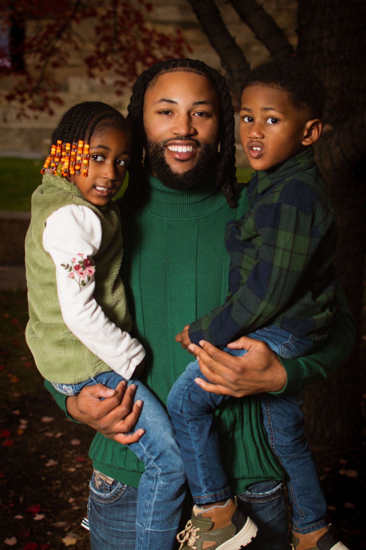 family portrait of black father and black son and black daughter