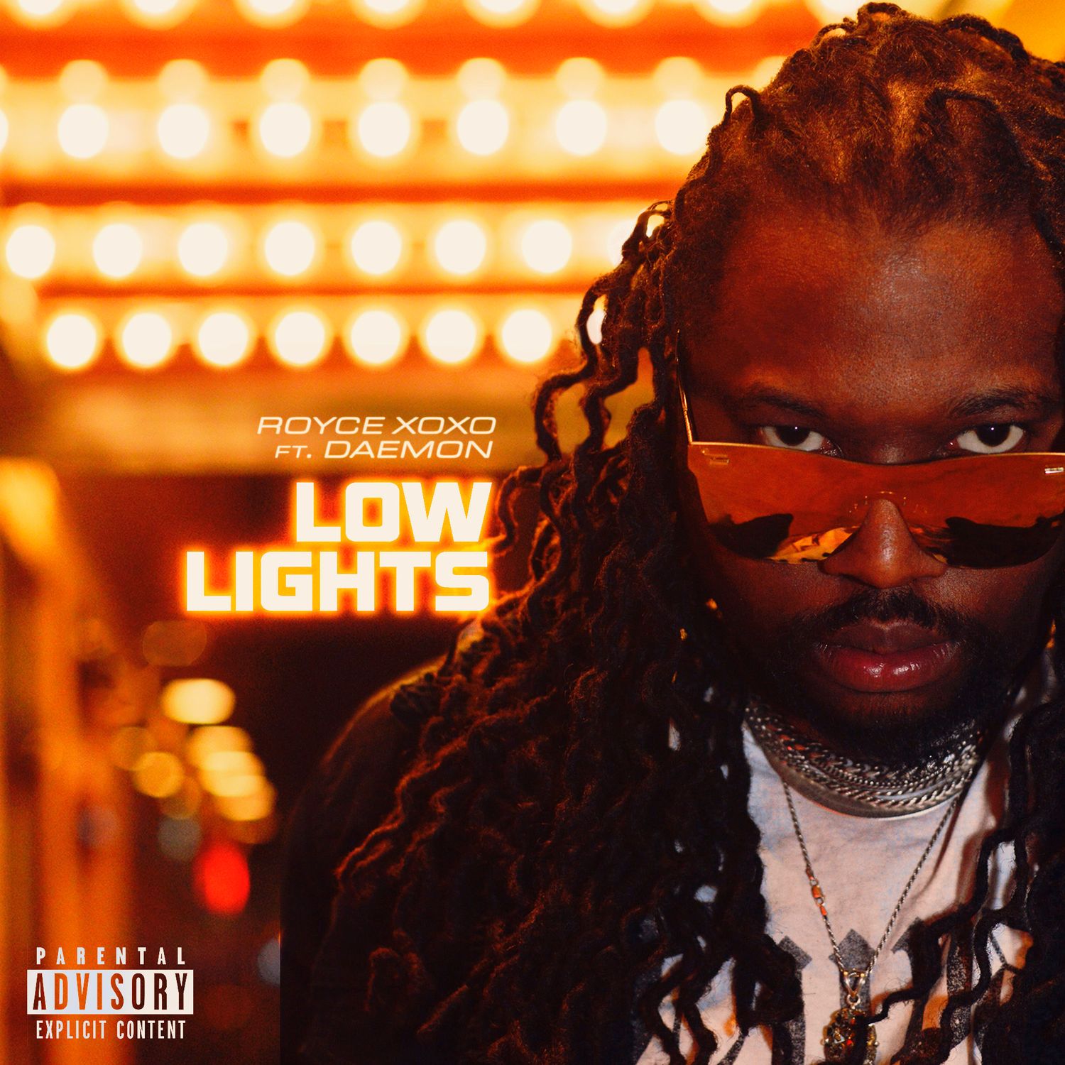 Music artwork with warm orange lighting and neon marquee lights in background.
