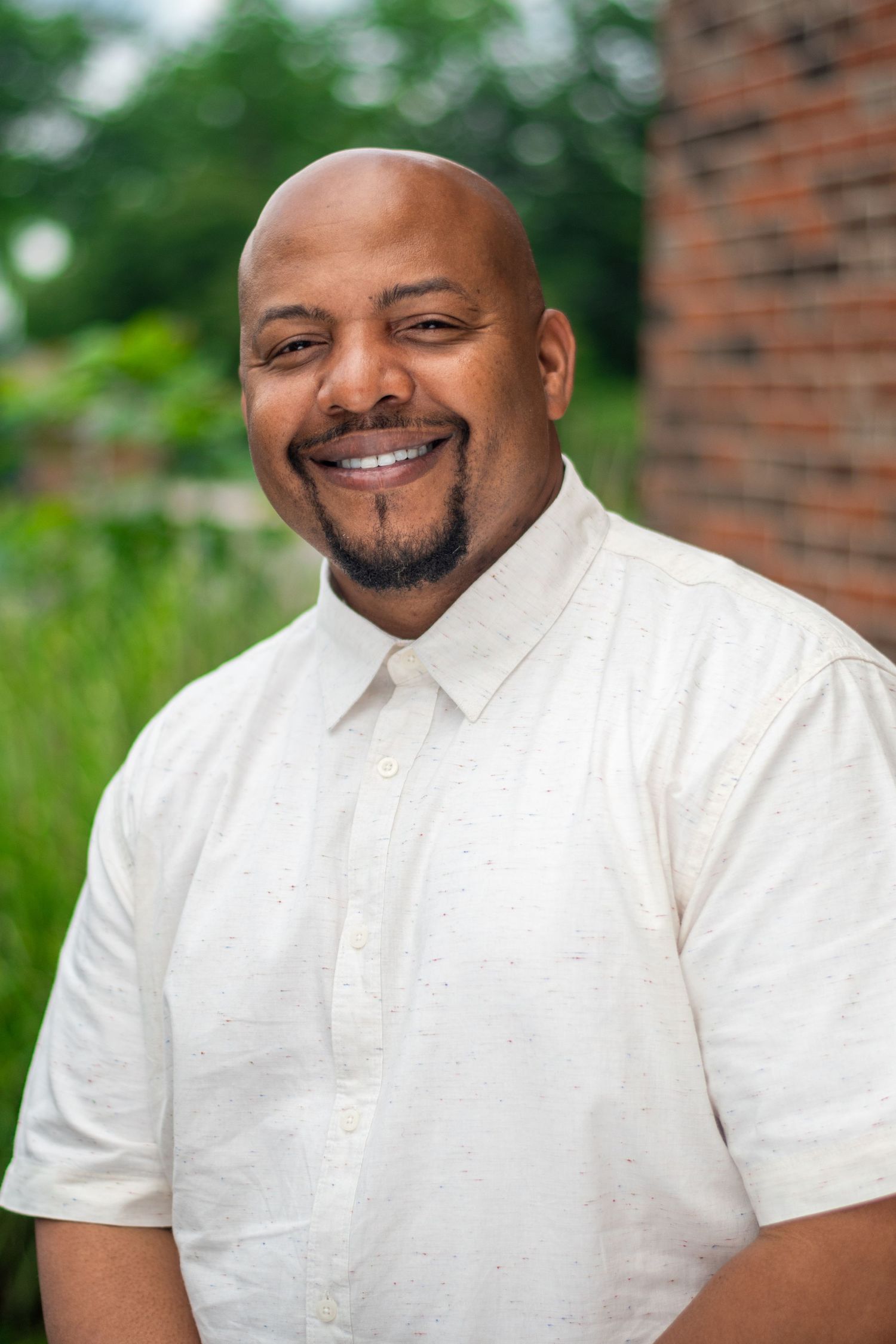 Series of casual portraits showing warm expressions in white shirt against natural background.