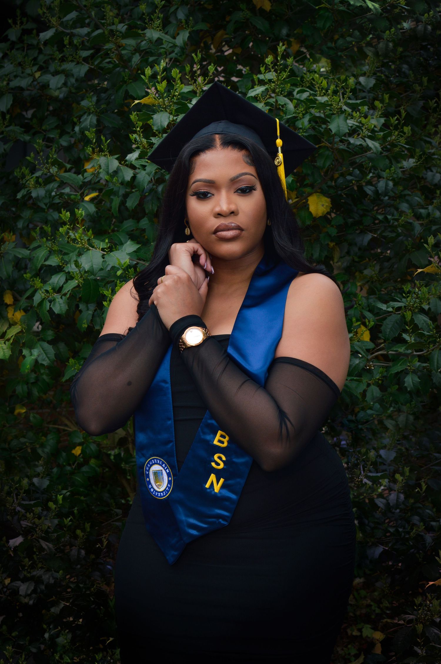 A graduation photo series featuring blue and black academic regalia against a natural outdoor backdrop with greenery.