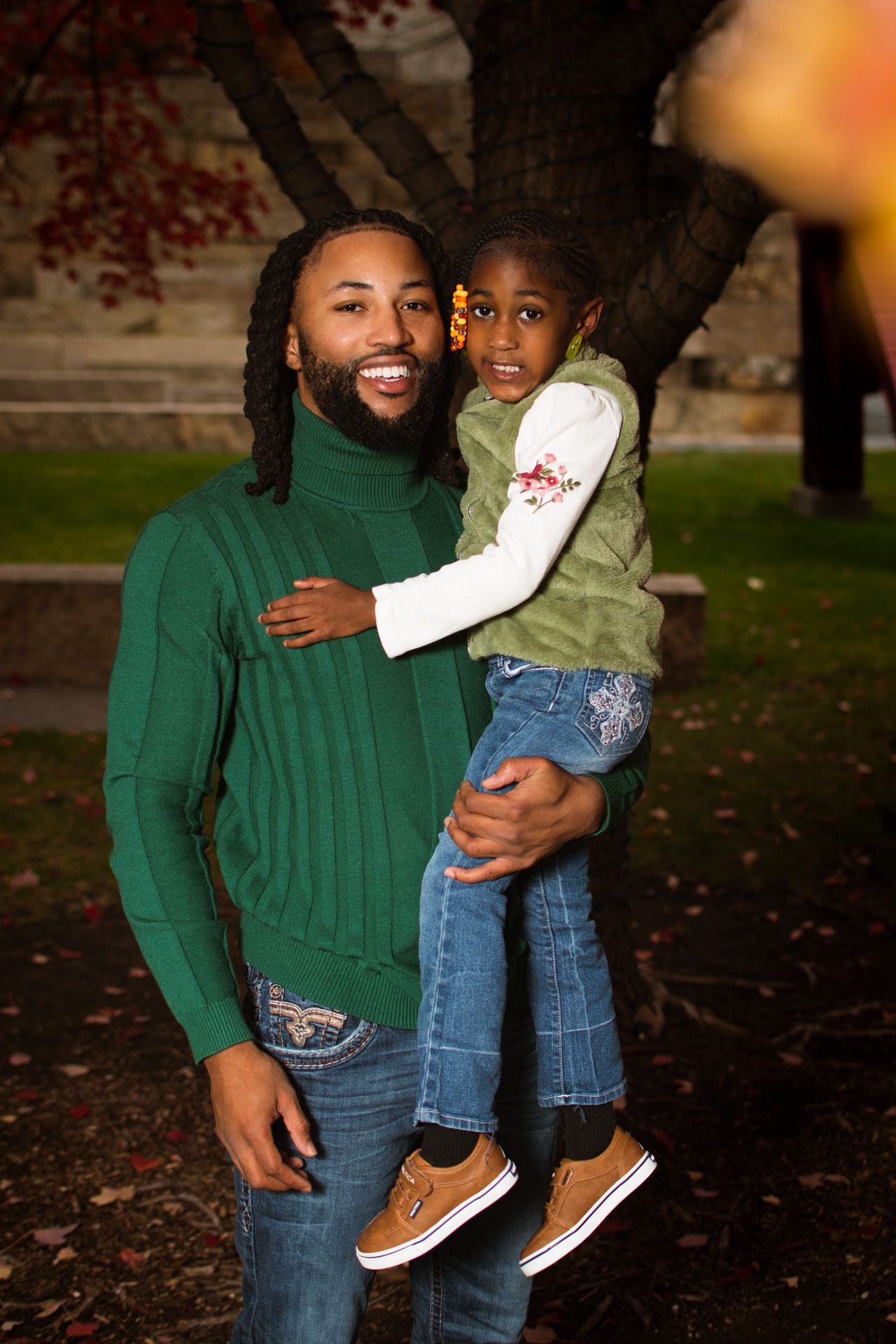 family portrait of black father and black daughter