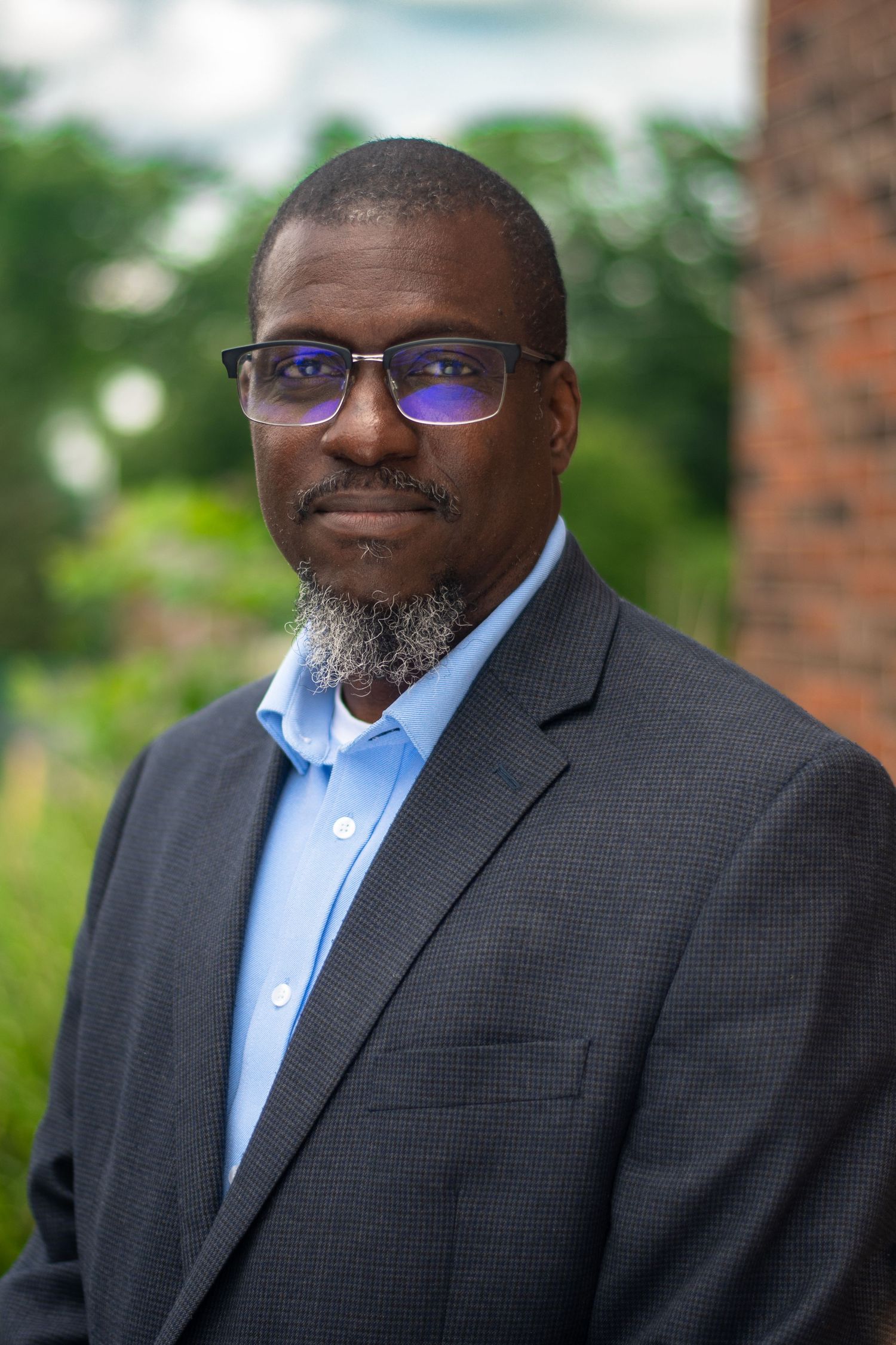 Professional headshot series of a person in business attire.