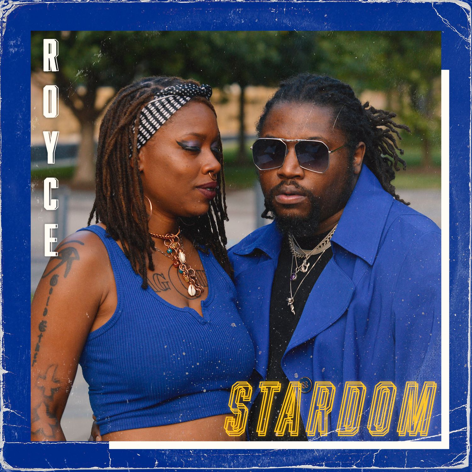Album cover showing figures in blue outfits against a royal blue background.