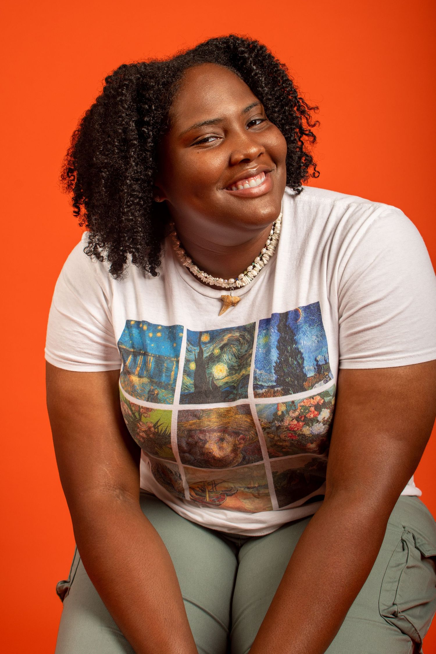 A series of photos showing a person in a white graphic t-shirt and olive pants against a bright orange background.