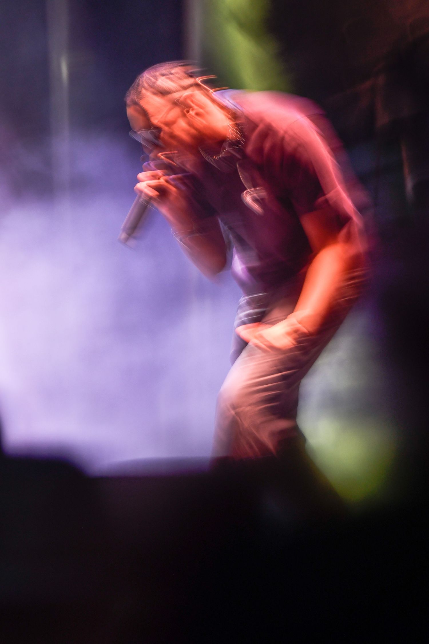 Motion blur sequence shows a figure performing a dynamic skateboarding trick against a purple and green background.