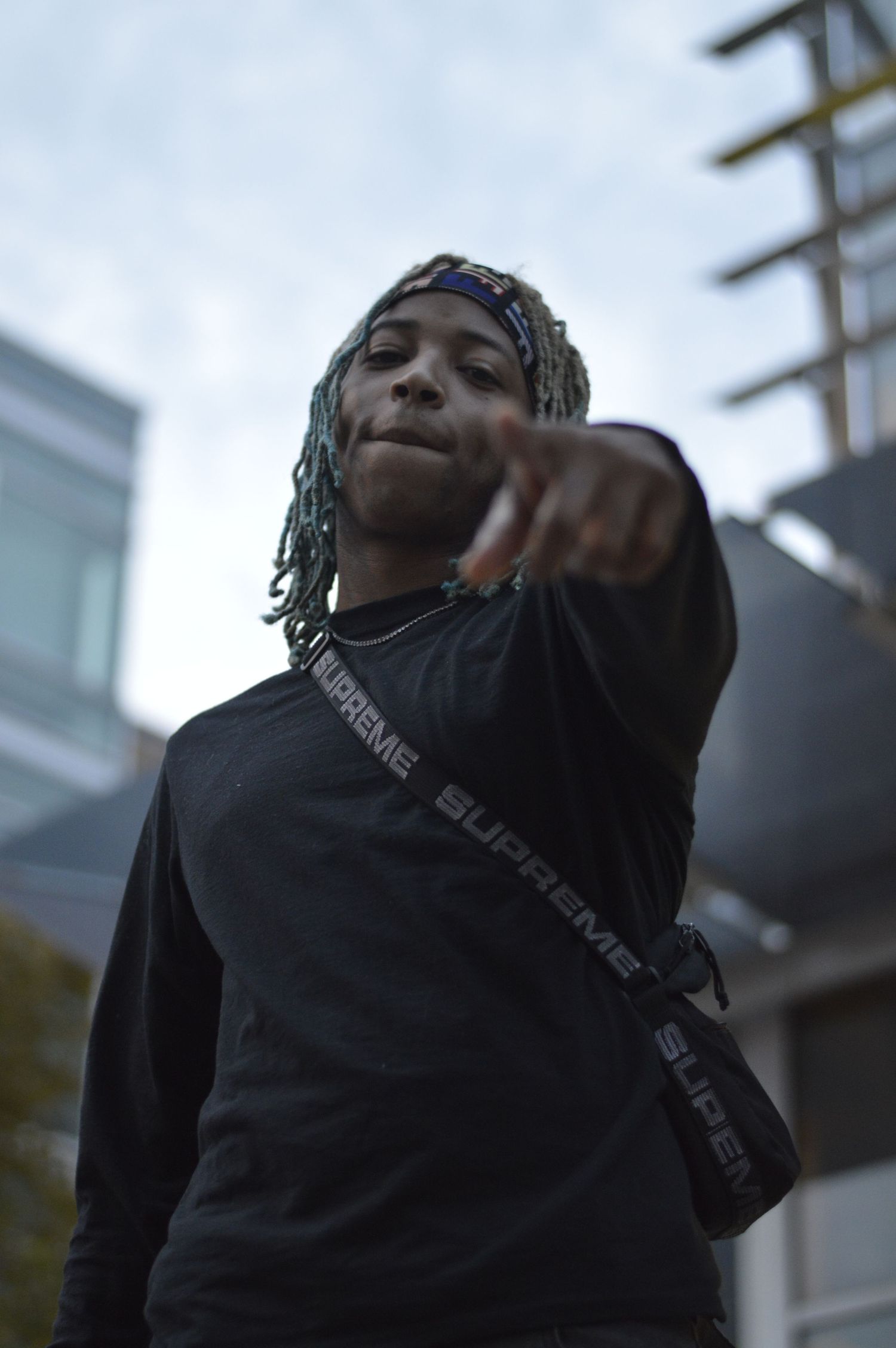 A series of candid shots shows someone wearing a black hoodie looking upward with a joyful expression.
