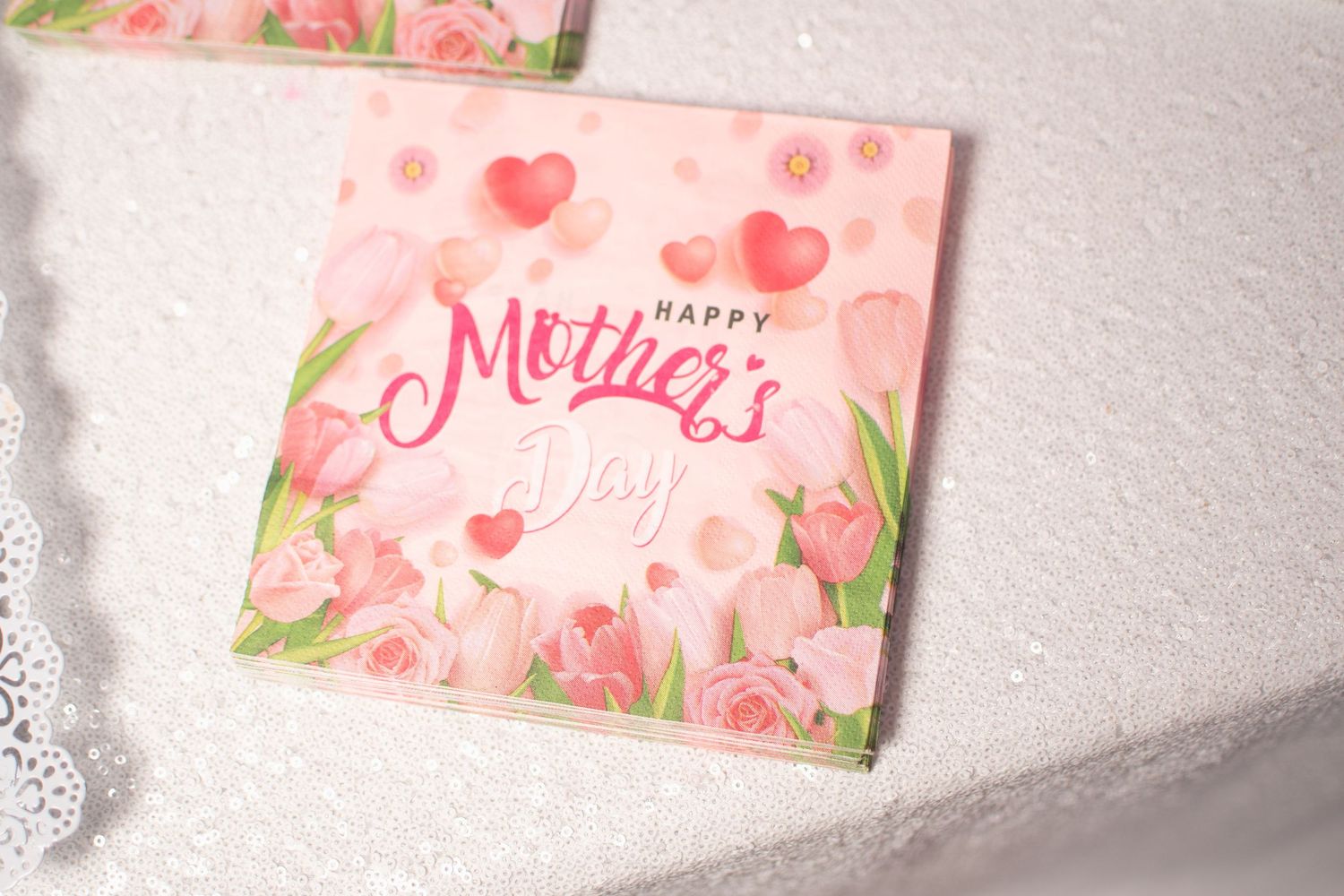 Pink floral wedding stationery with watercolor designs and heart motifs.