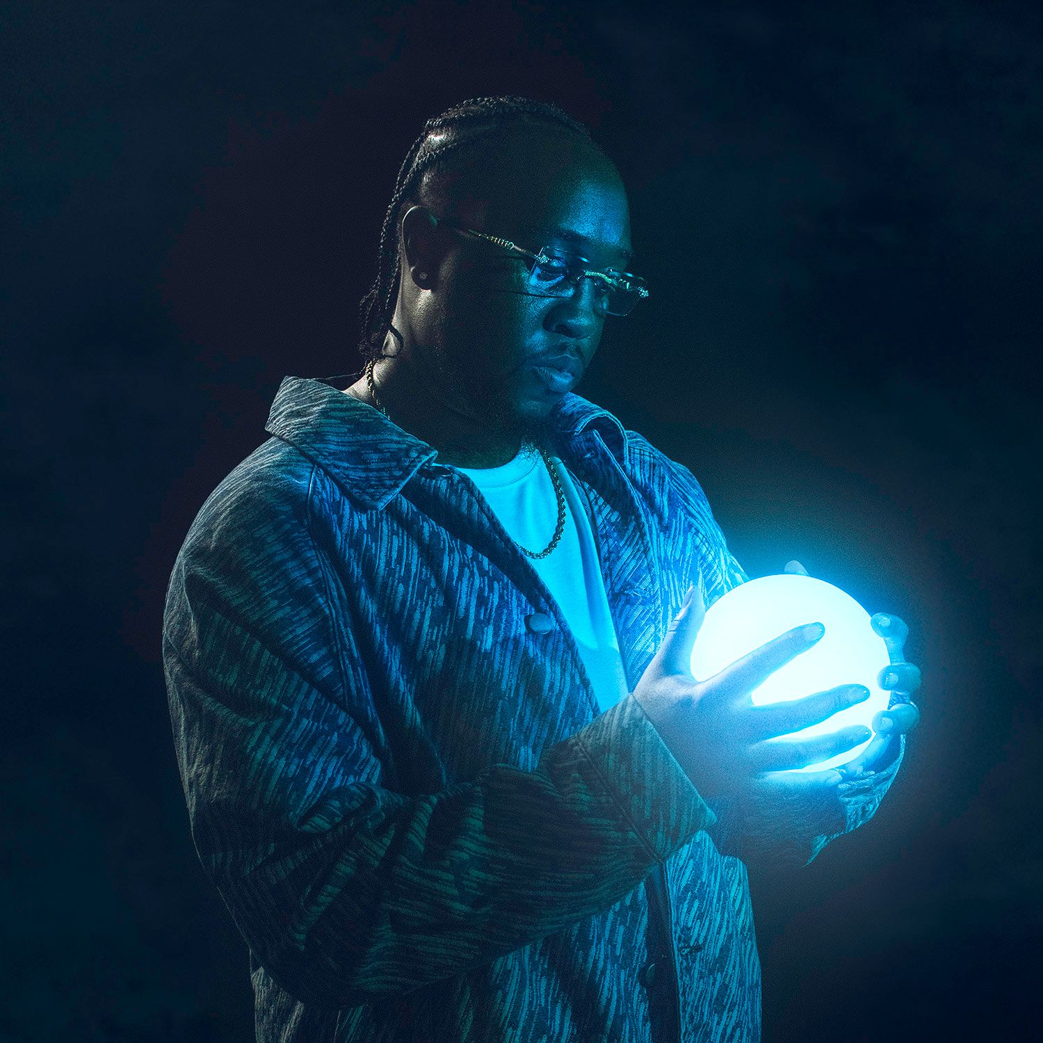 Artistic sequence showing glowing blue light effects against dark background.