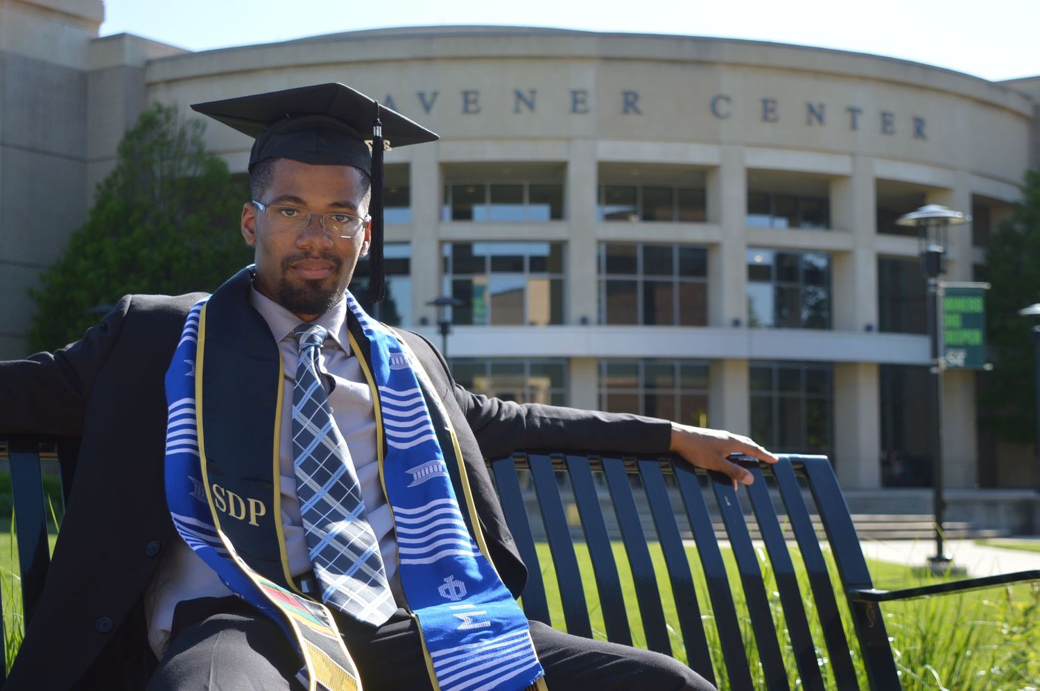Black Graduation celebration photos captured in front of a campus center building.