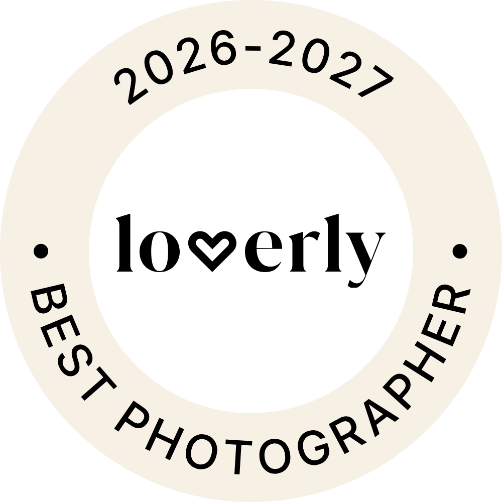 Loverly Best Photographer badge for 2026-2027, circular seal with heart logo on cream background.
