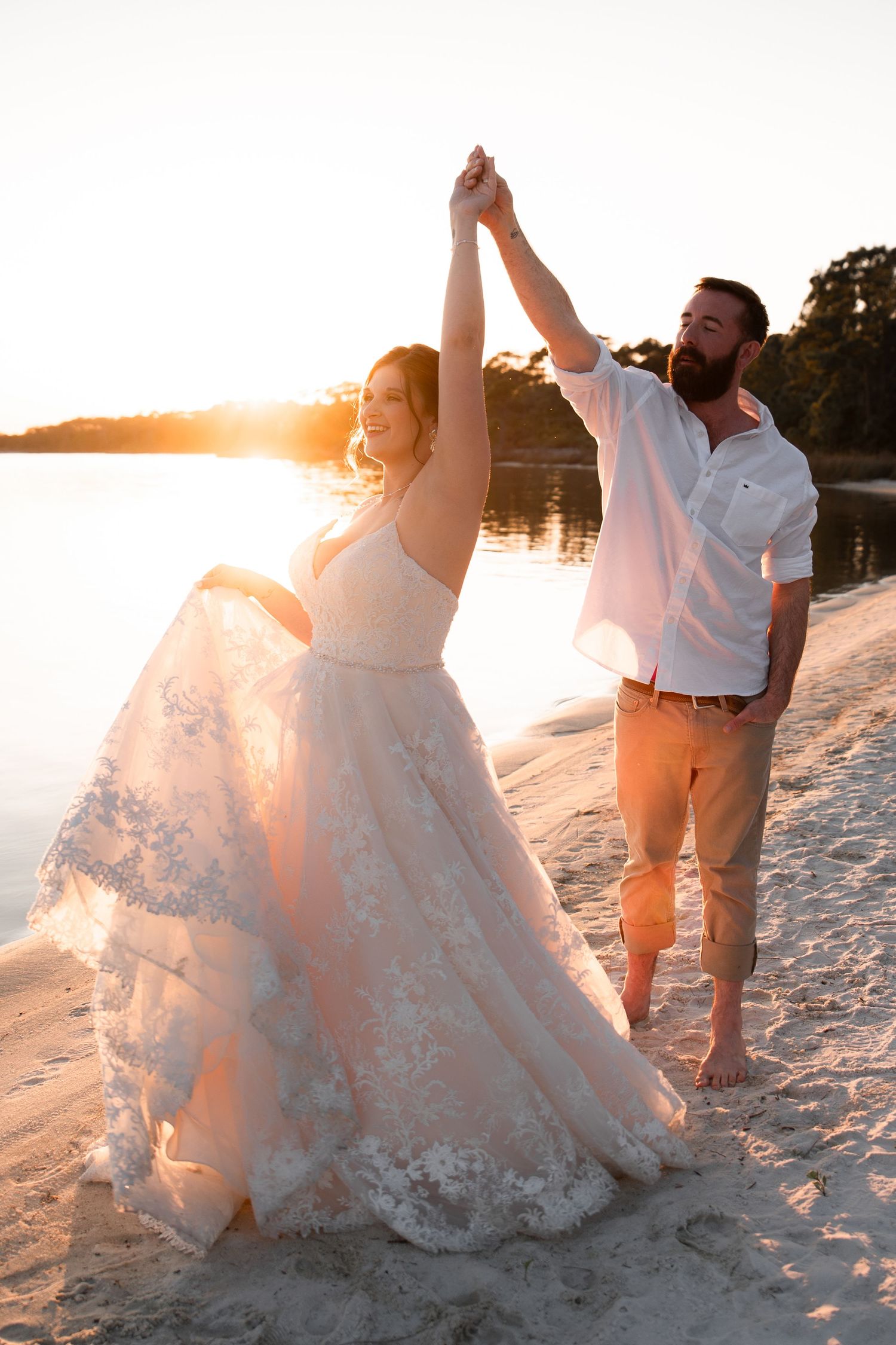 Soft and dreamy coastal wedding session featuring couple at sunset shoreline