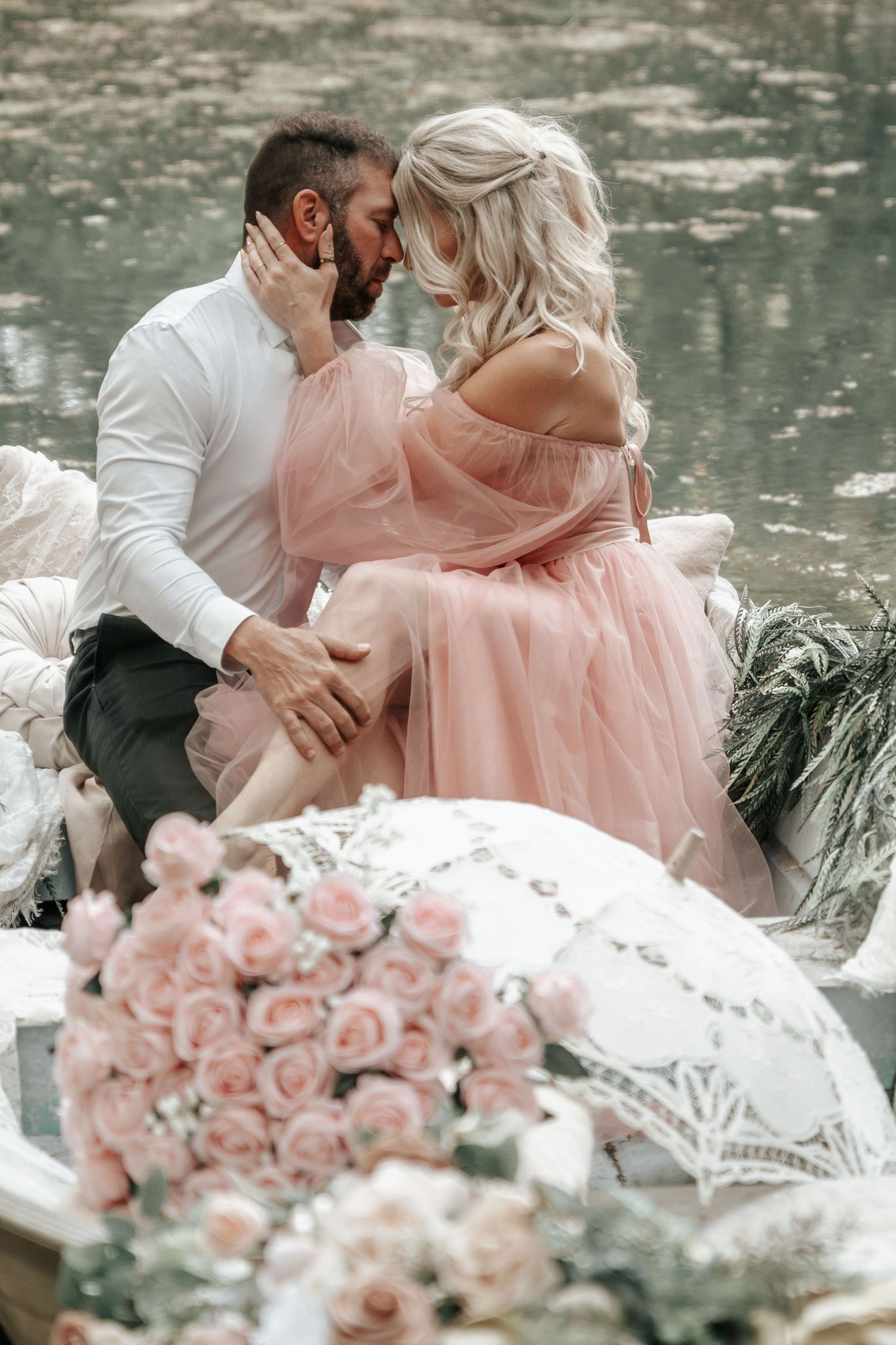 Intimate coastal photo of couple on a dreamy boat with warm evening light