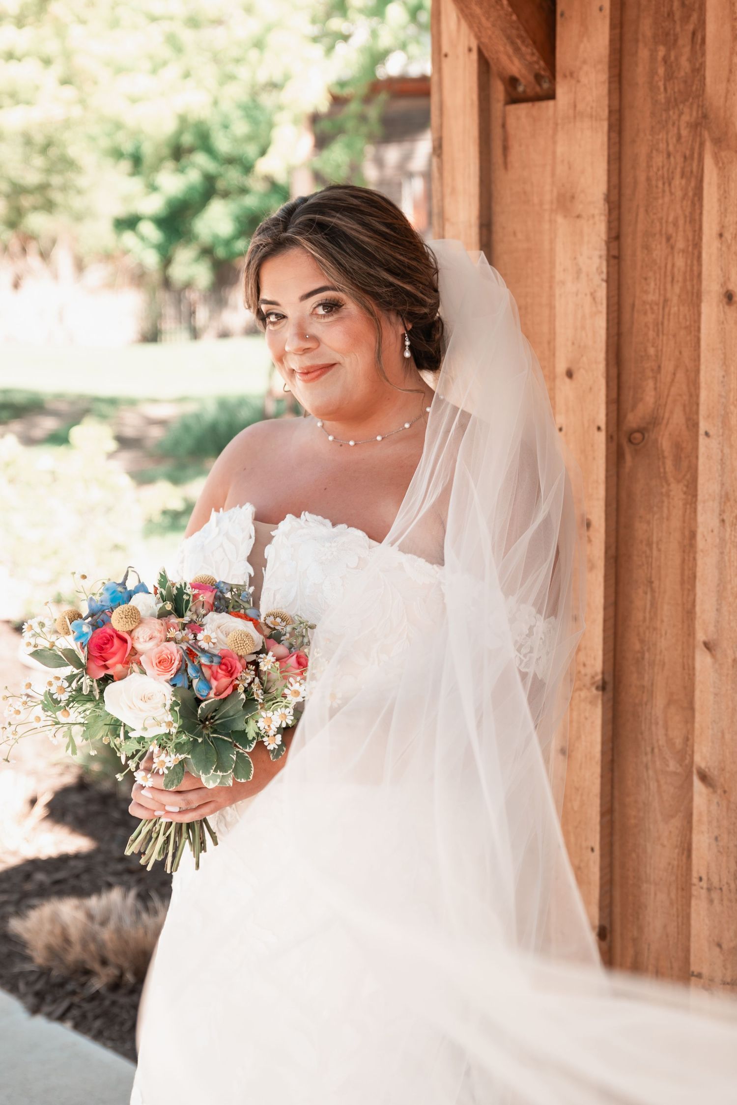 Elegant bridal portraits of a bride in a flowing gown during soft golden hour light in the Midwest