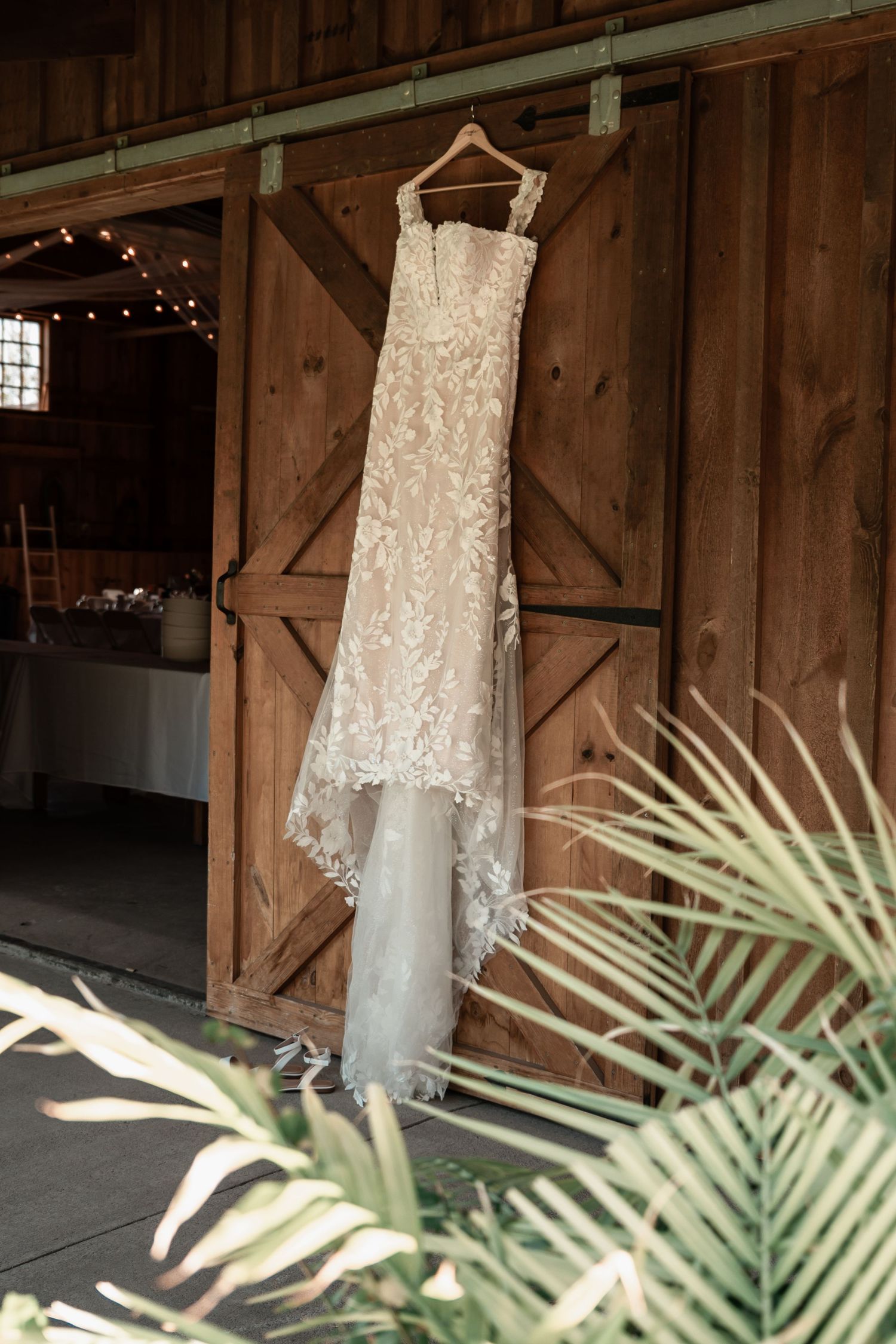 Elegant bridal gown details featuring intricate fabric textures and soft ivory tones