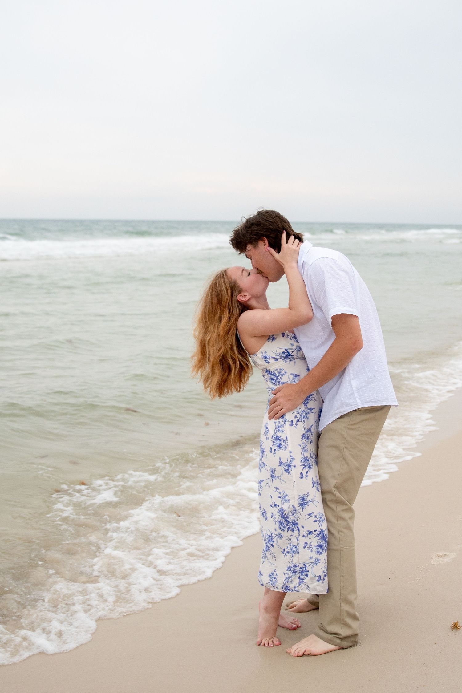 Intimate coastal engagement proposal captured during sunset on Gulf Shores beach