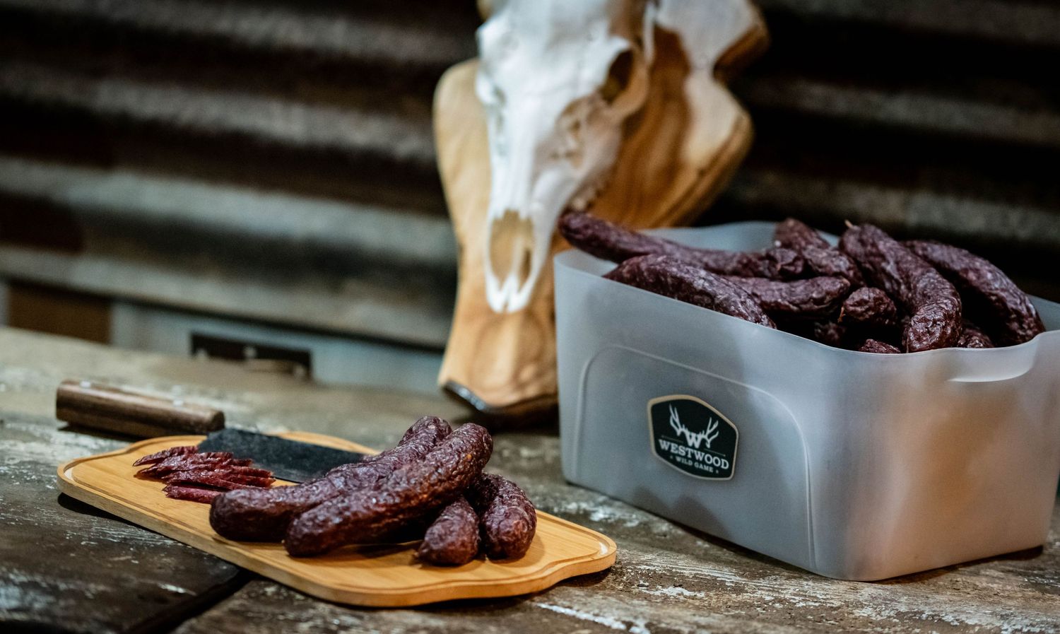 Dried sausages or meat products displayed with rustic wooden elements.
