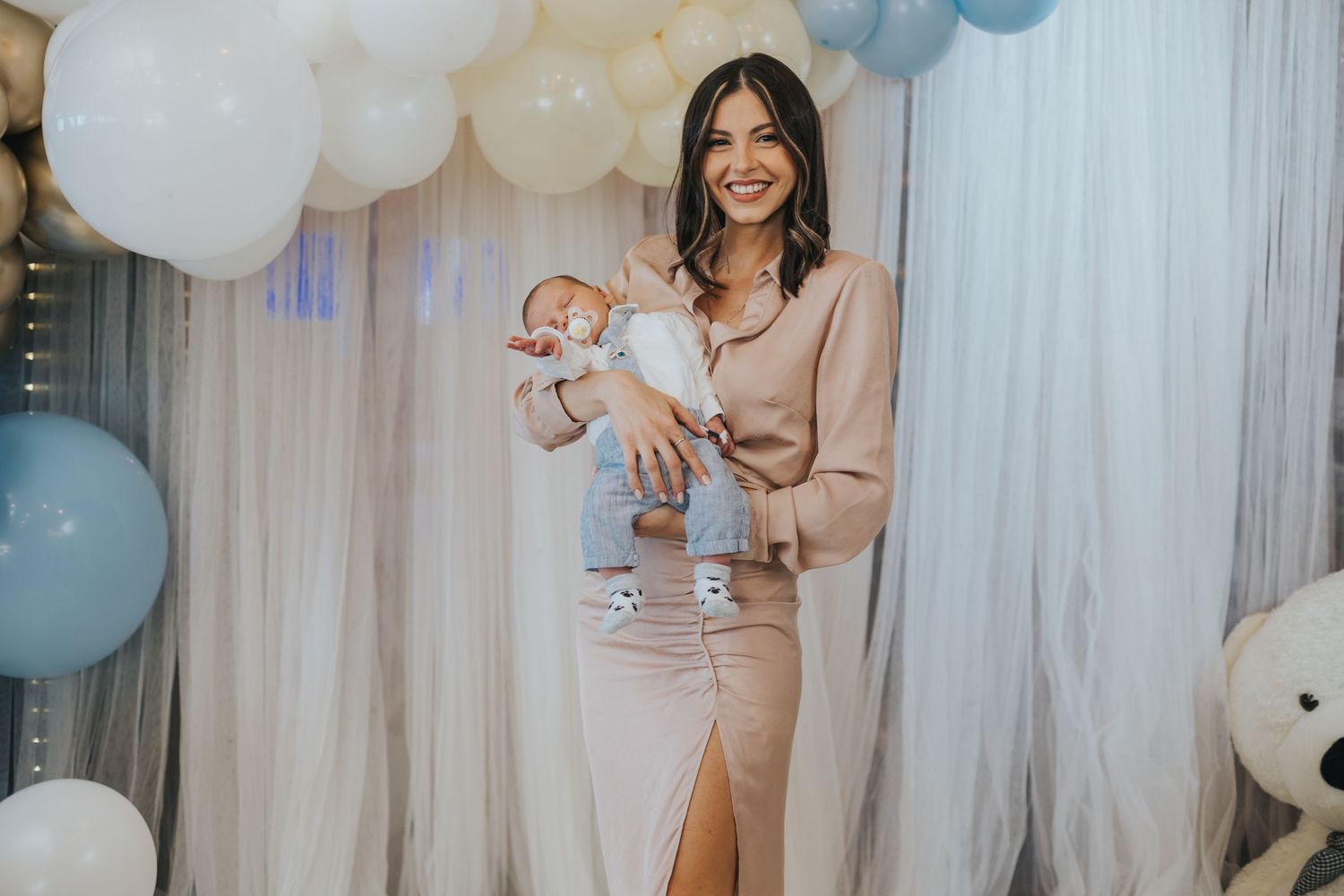 A celebration scene with balloons and decorations at a baby shower party.