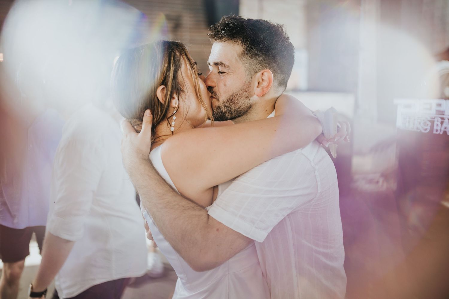 Romantic moment captured through soft focus lens during a wedding celebration.