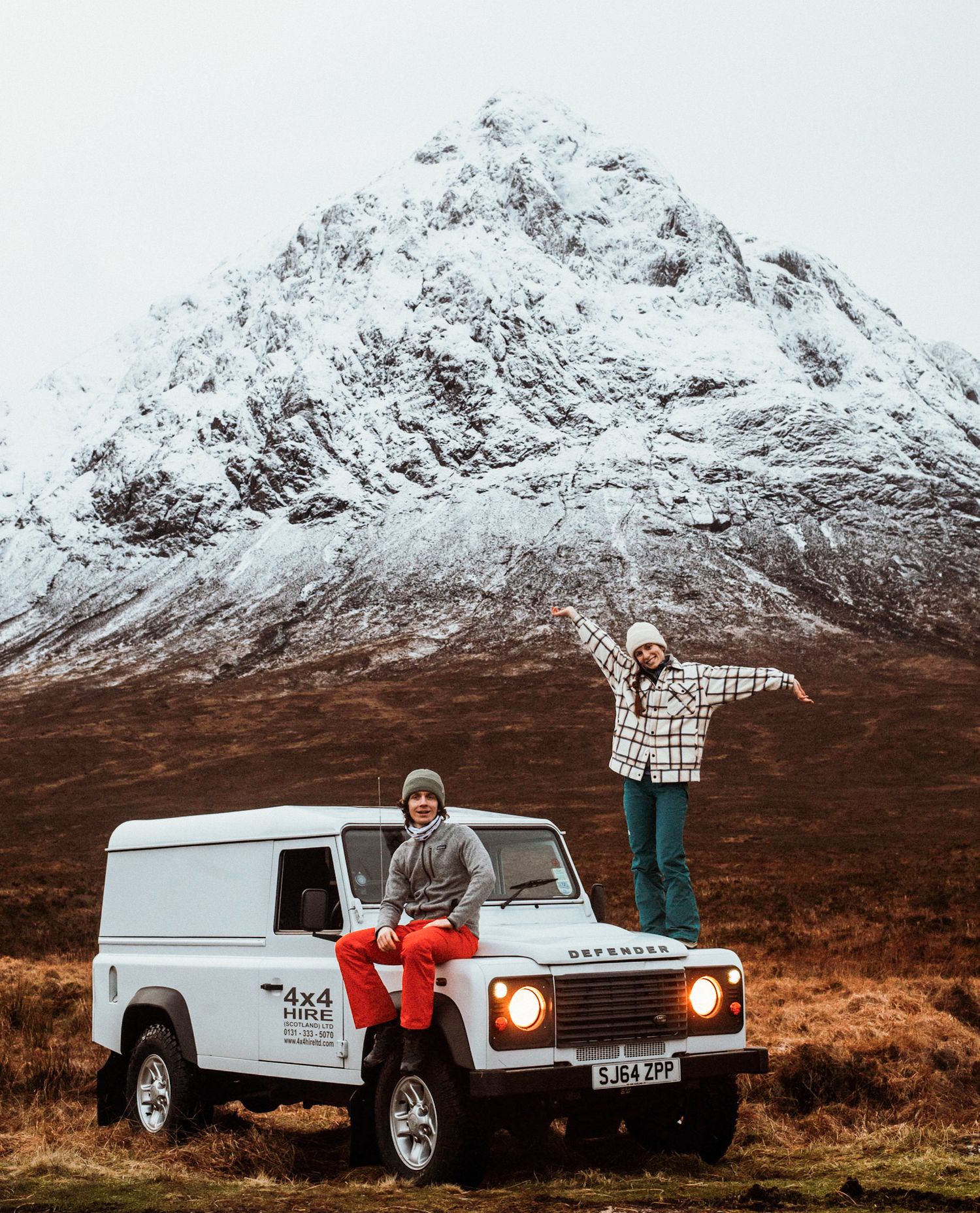 Self portrait of couple photographers in the mountains of the Scottish Highlands.