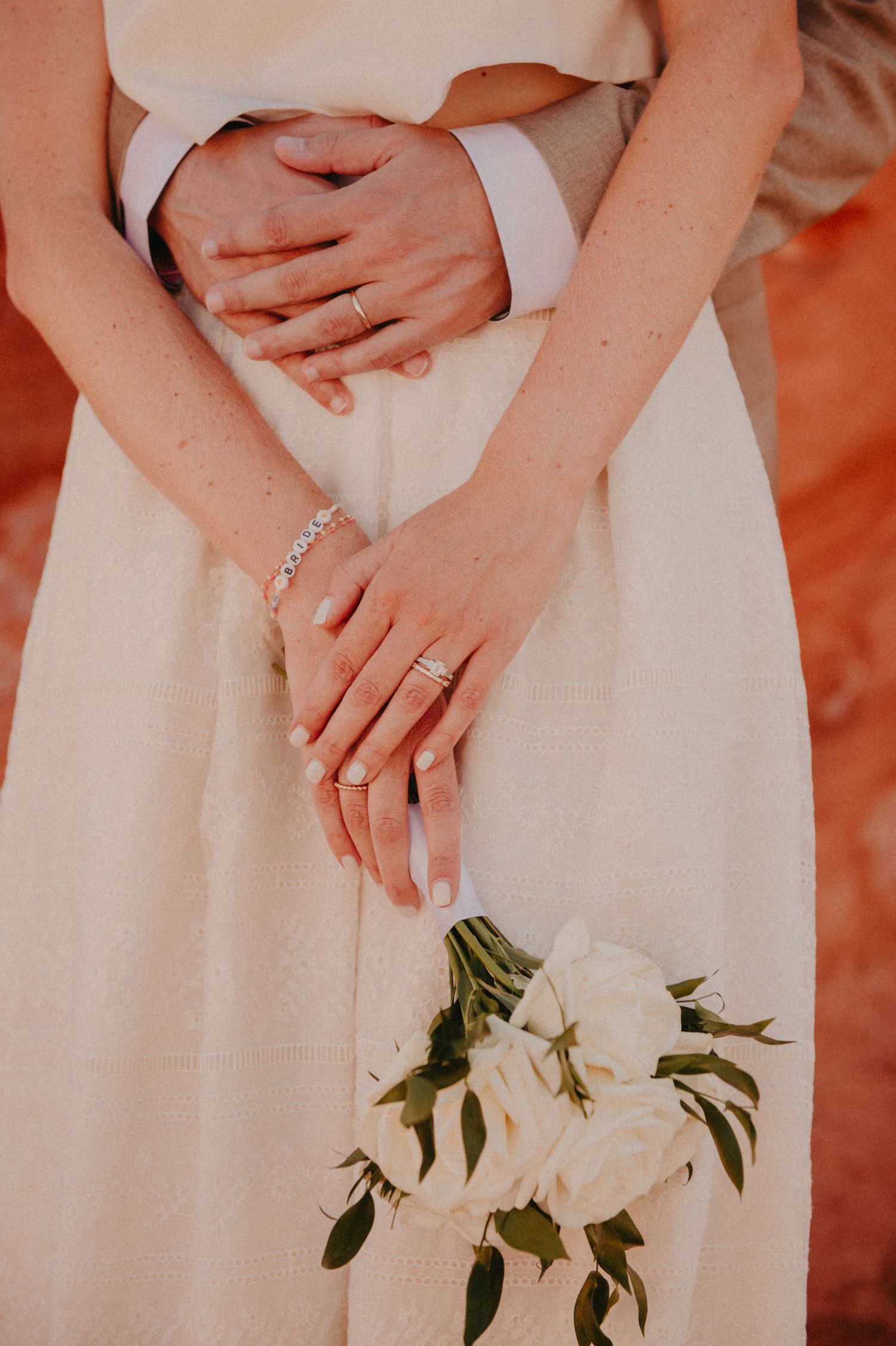 Close up of hands and rings of bride and groom during destination wedding in Nevada, USA.