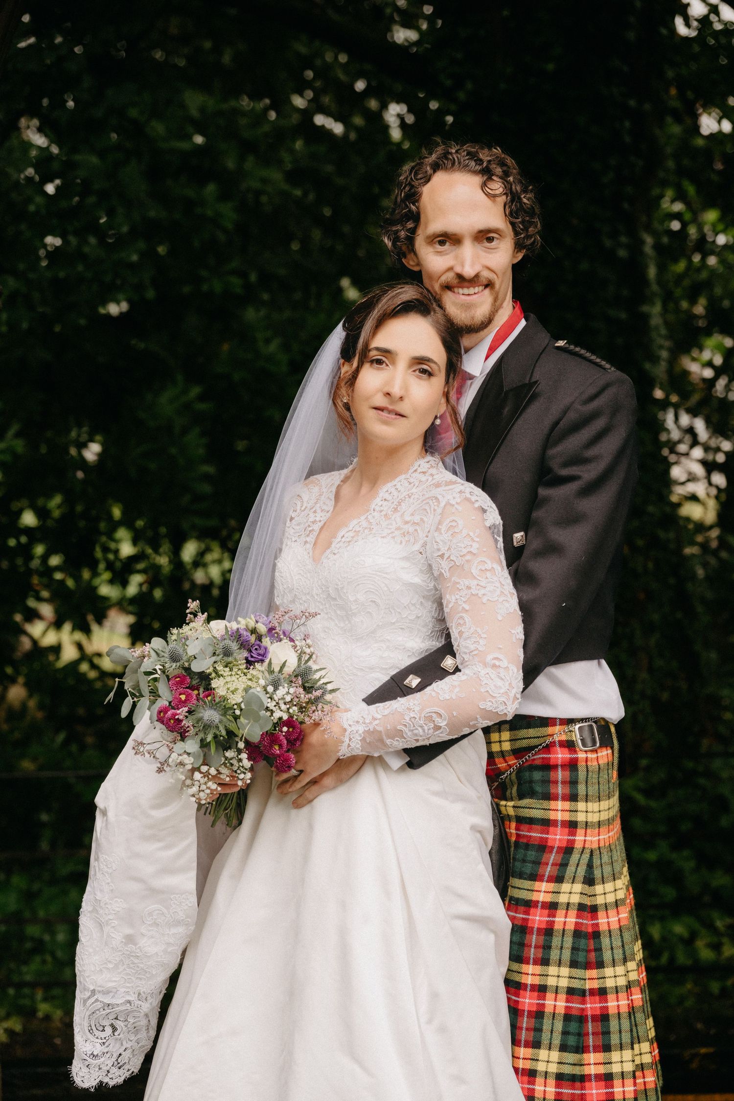 Bride and groom embracing in Scottish castle wedding