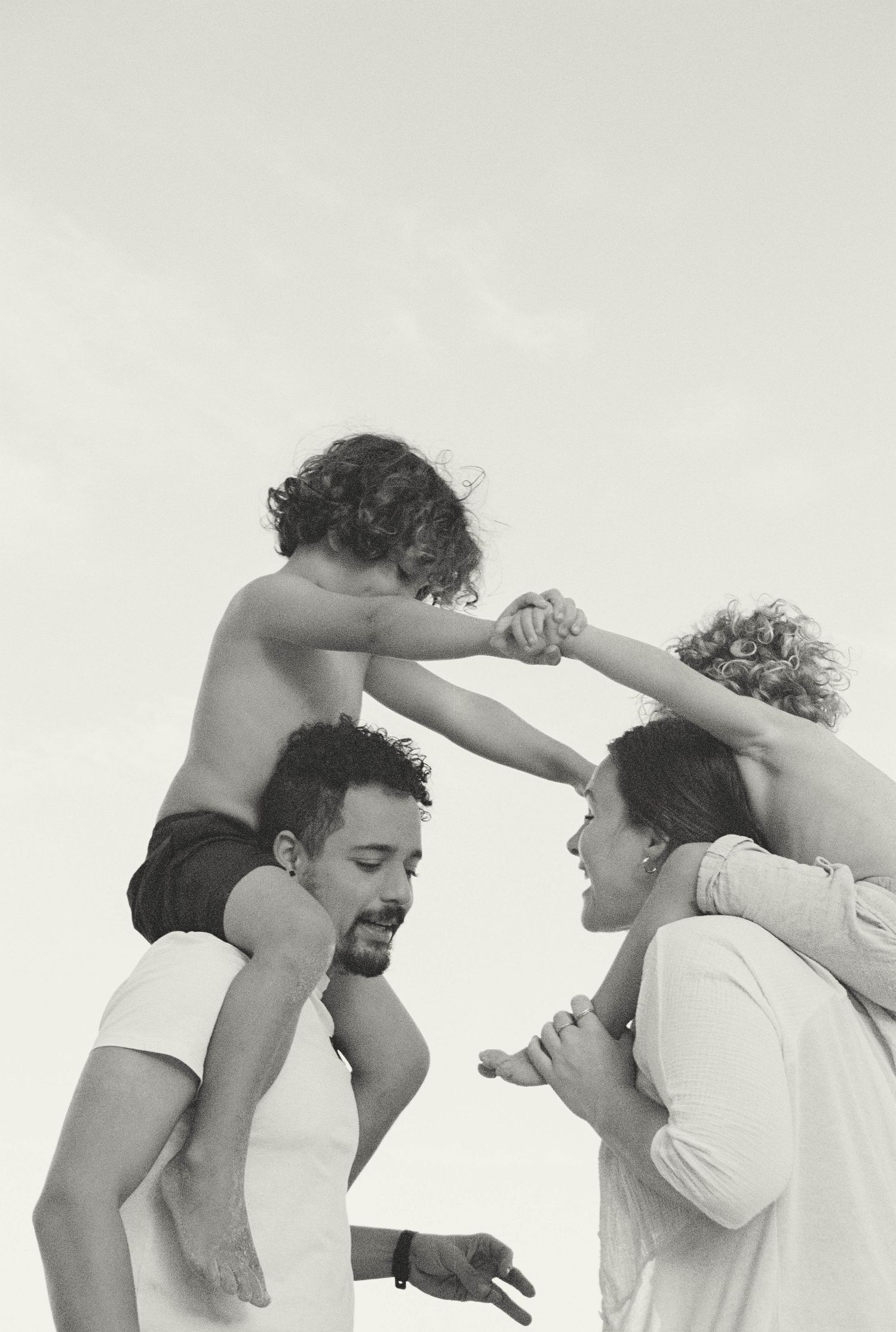 A playful black and white sequence showing two people dancing and spinning together against a plain background.