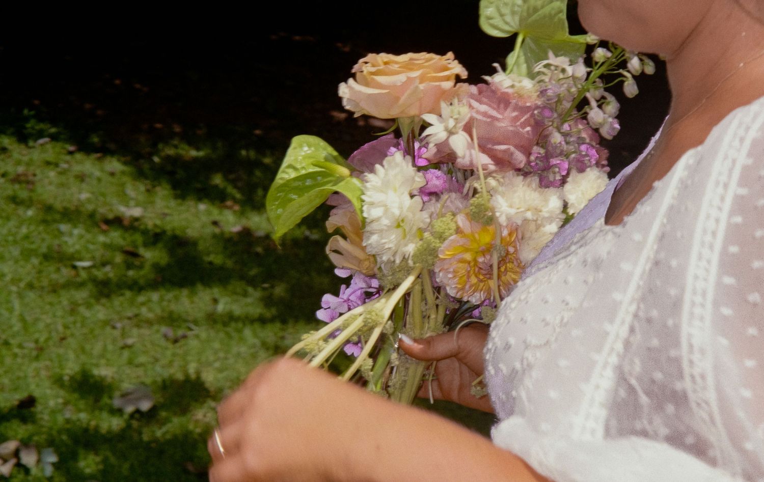 A row of delicate pastel floral bouquets with white and pink flowers shown in detail against blurred backgrounds.