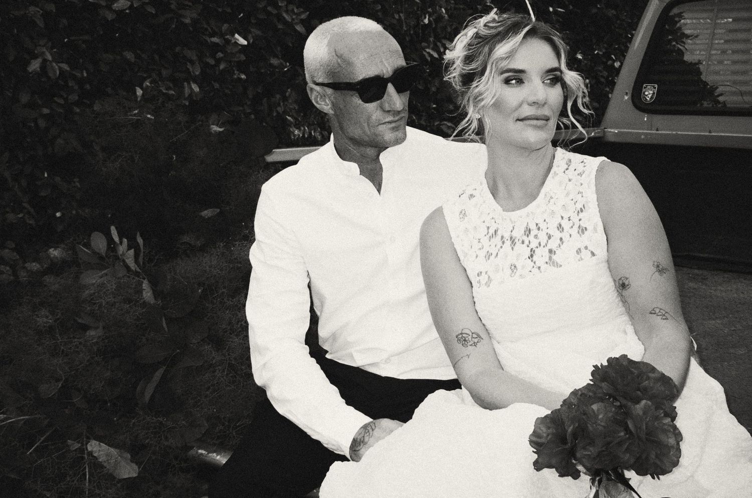 A series of black and white candid wedding photographs showing outdoor celebration moments.