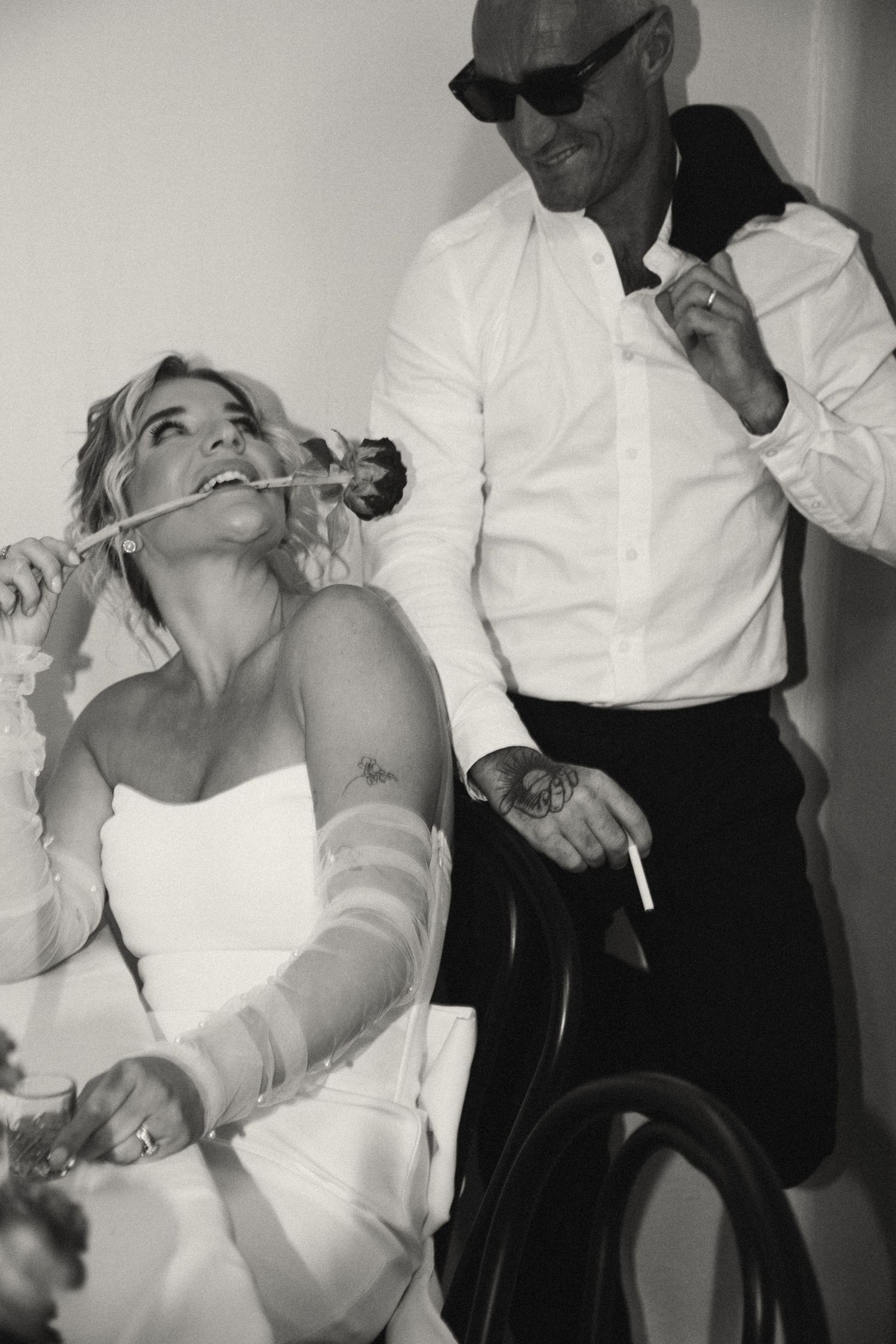 Black and white candid photos capturing playful moments during a celebration.