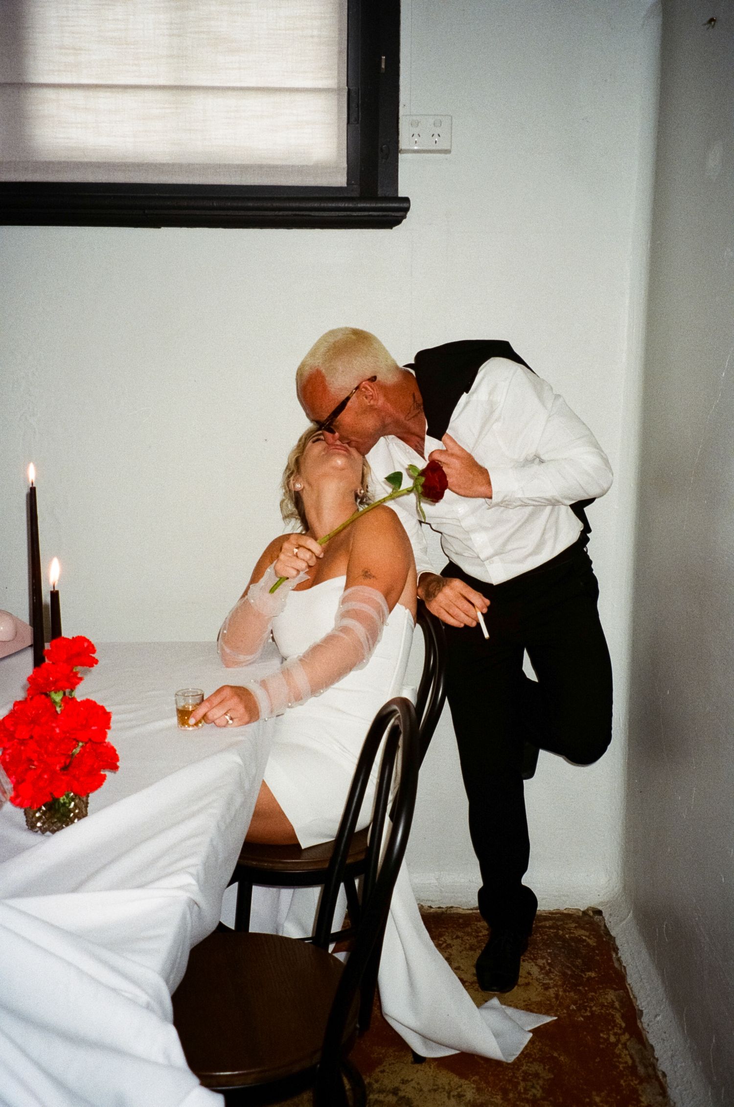 A romantic collection of black and white photos showing bride and groom embracing during their wedding.