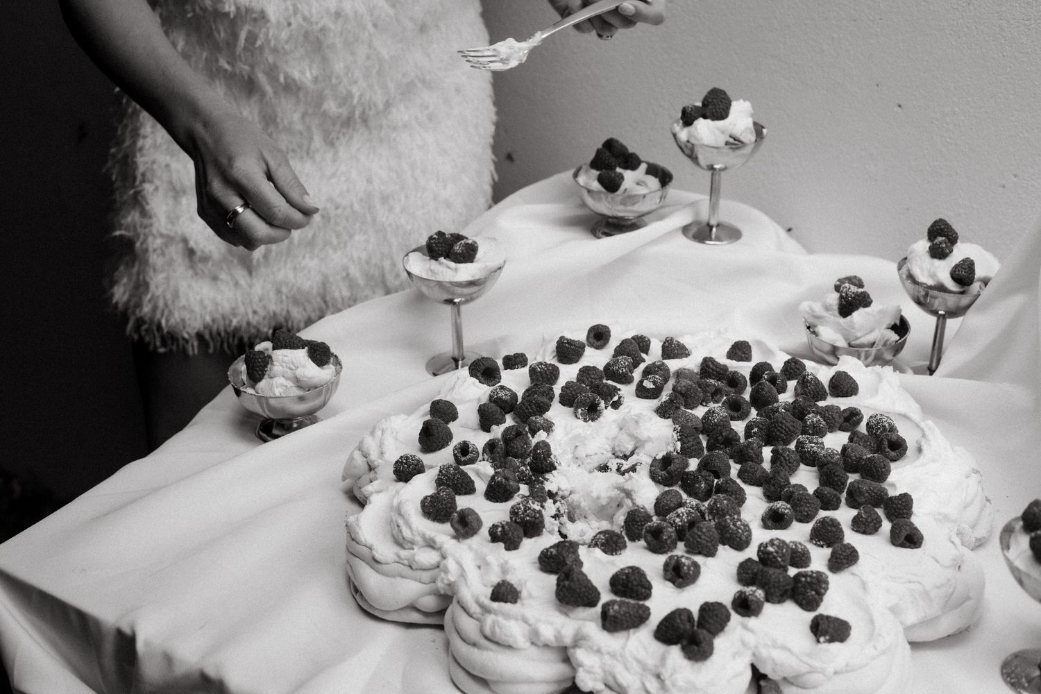 Catering display showcasing an array of bite-sized desserts and appetizers arranged on serving platters.