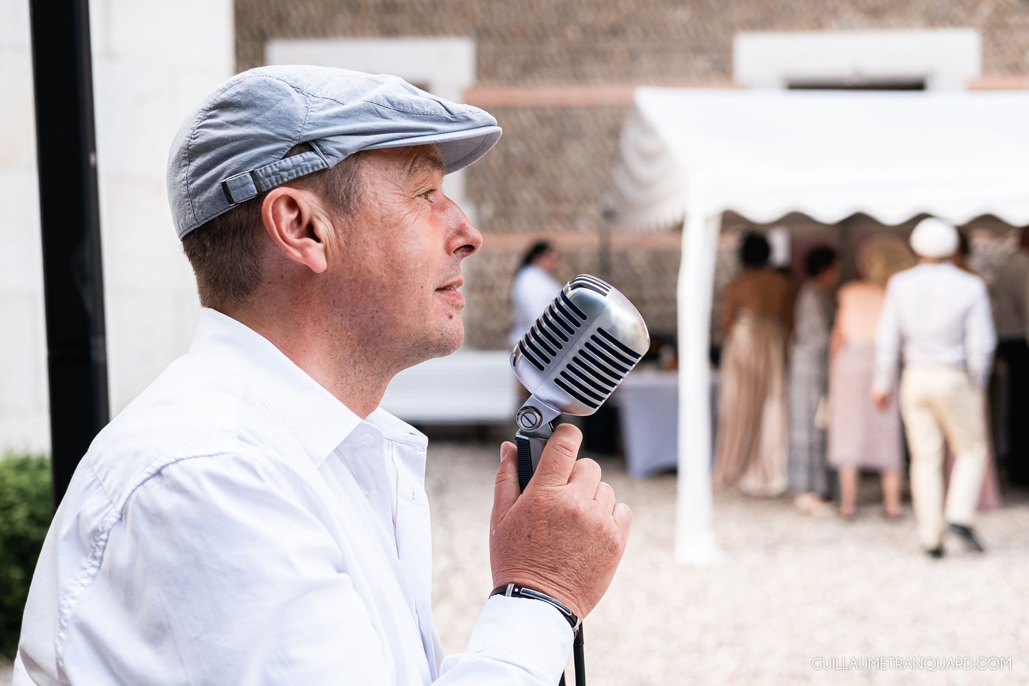 Wedding reception venue with DJ setup and microphone equipment.