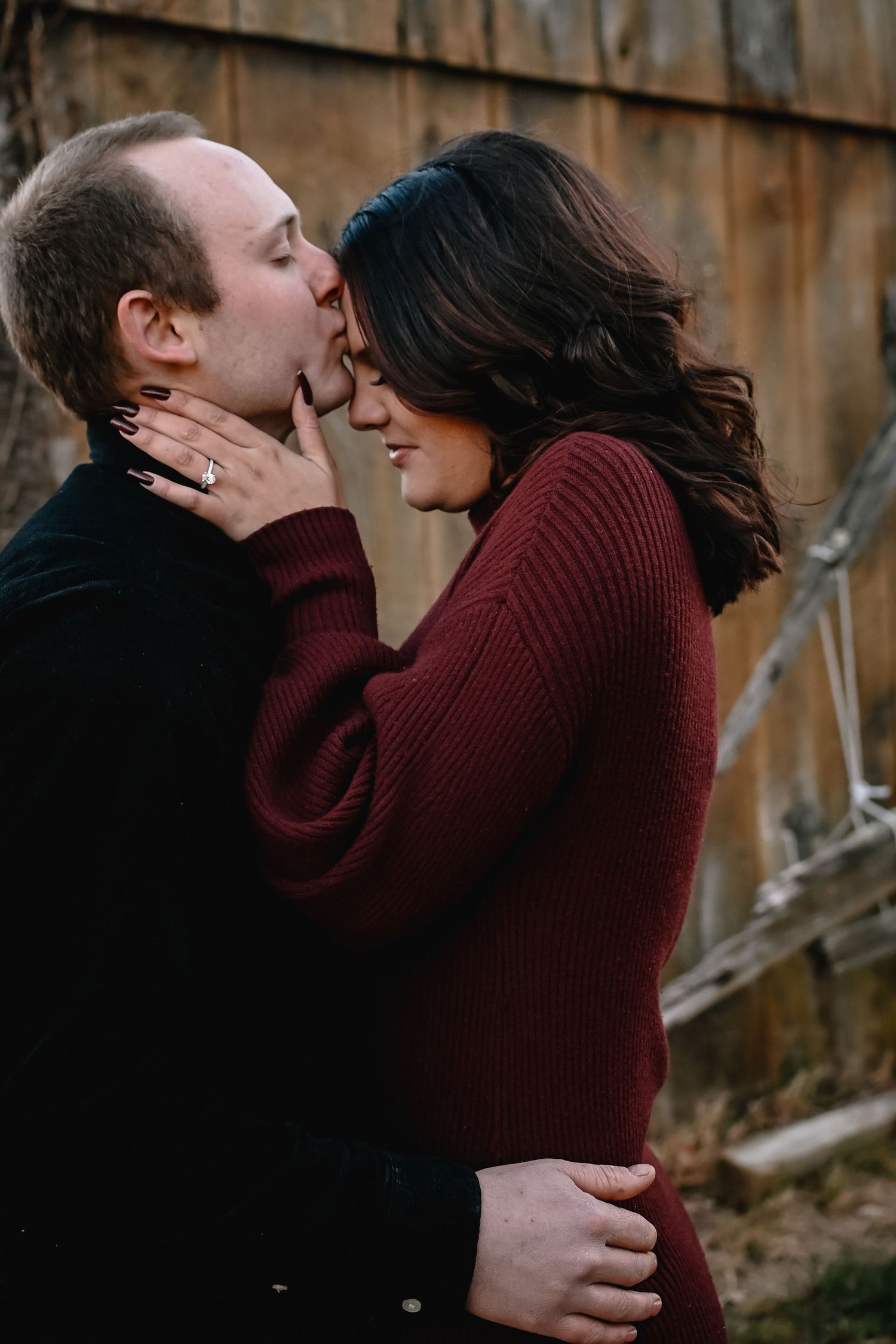 Boston engagement photographer featuring happy couple embracing.