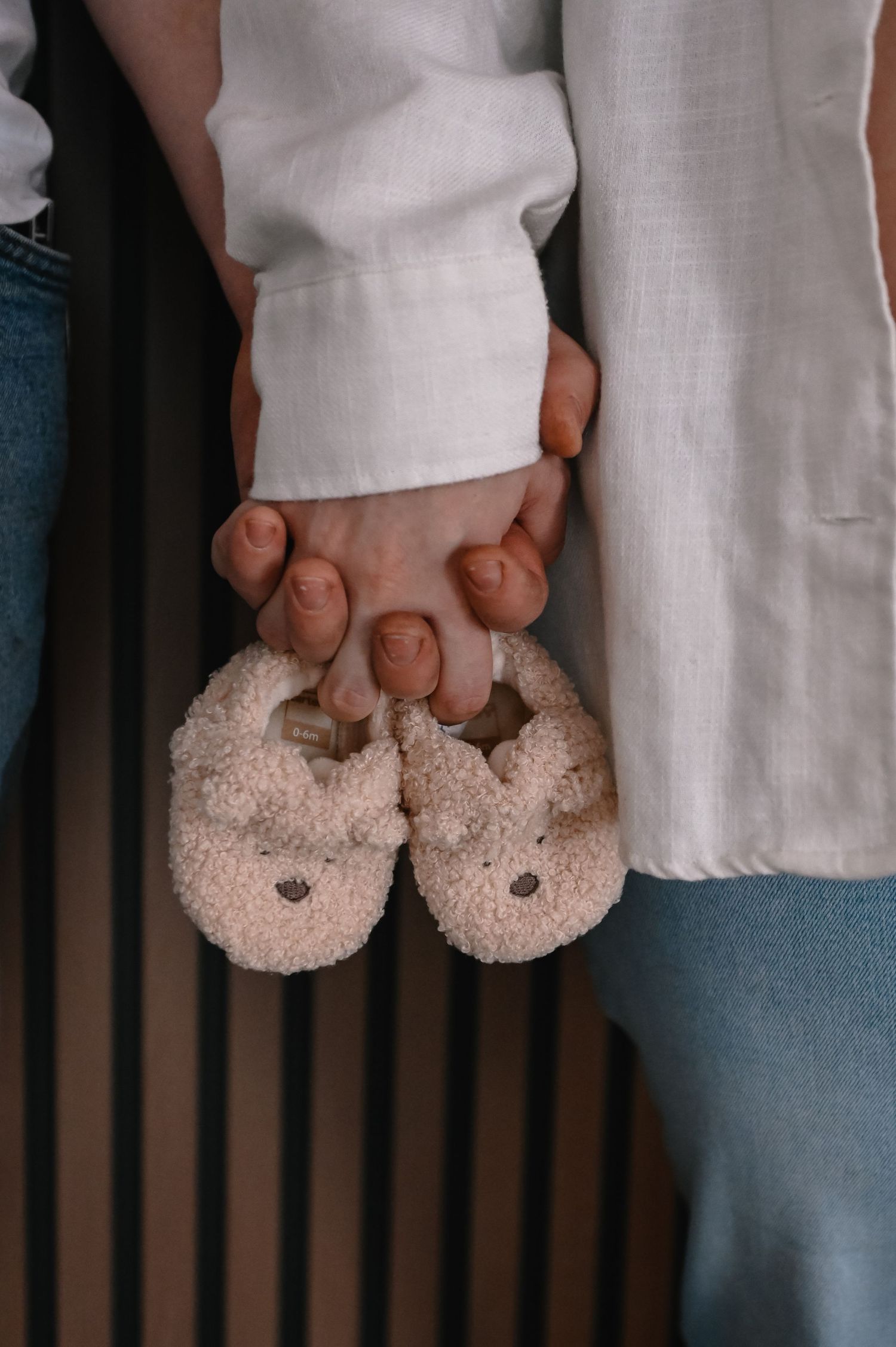 Maternity photography featuring mom and dad holding hands.
