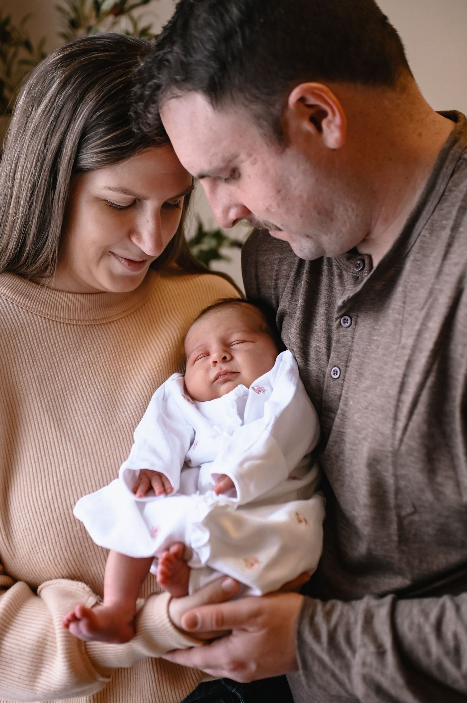 Newborn fresh 48 Photographer featuring  woman and man holding baby.