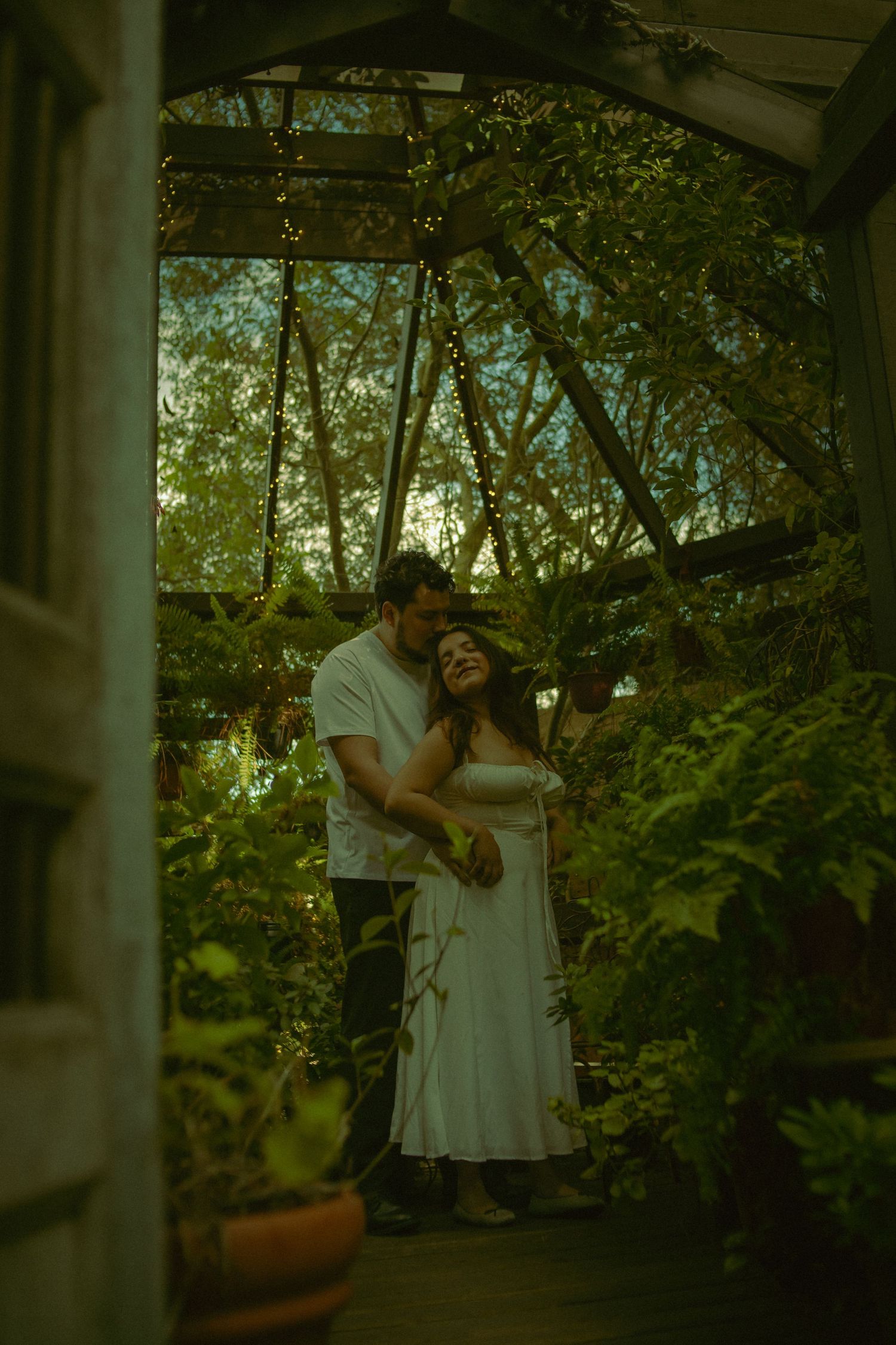 The Notebook inspired engagement photography session. Couple enjoying a greenhouse scenery in San Diego California