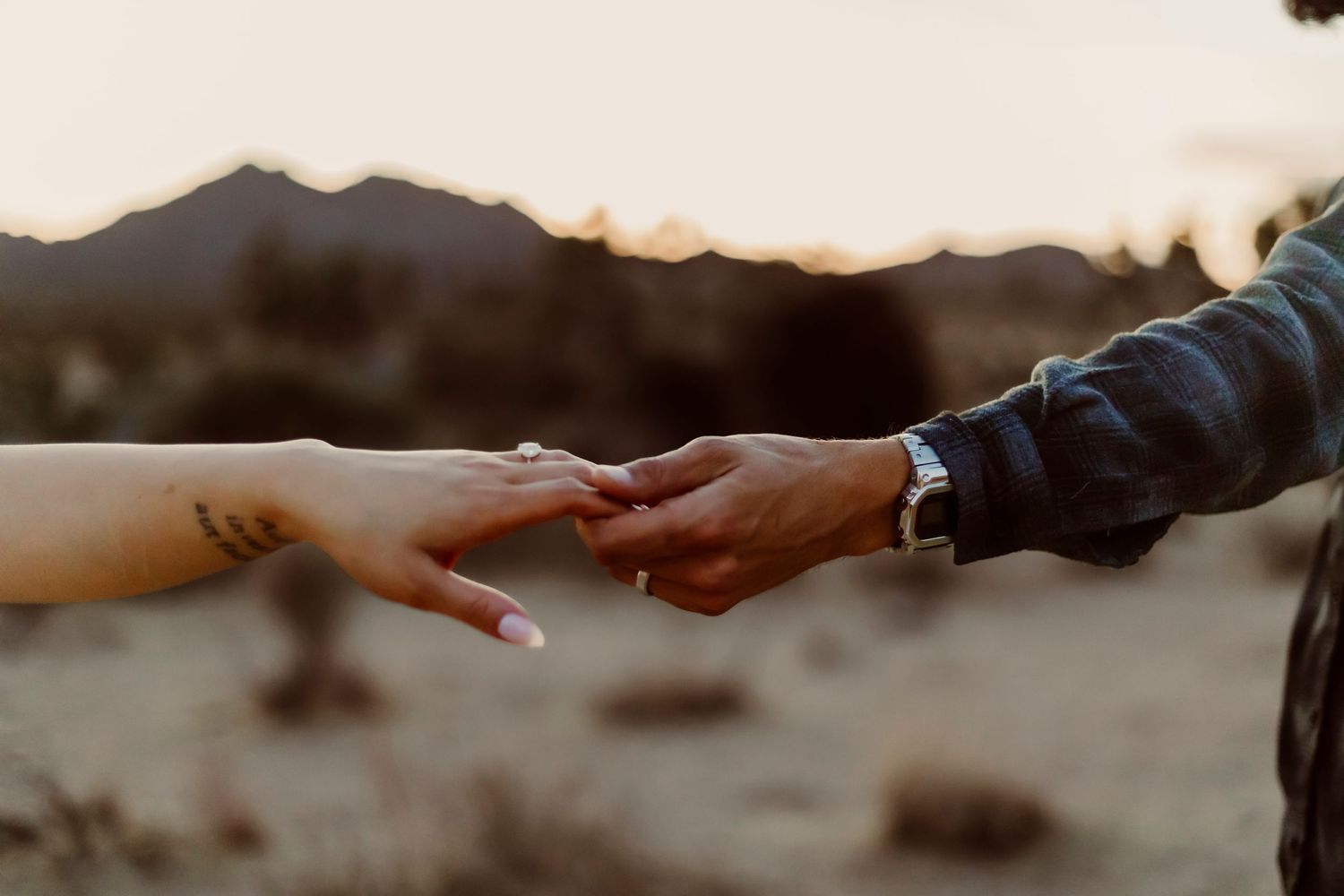 Romantic hand holding cinematic photography in Joshua Tree California