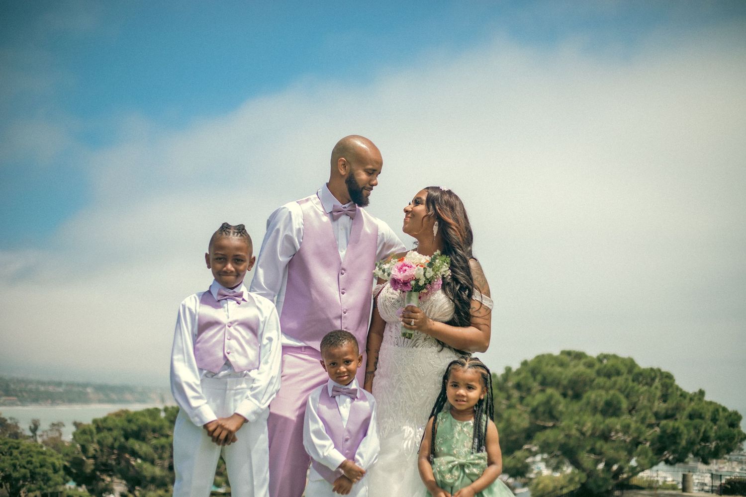 Bride and Groom after their beautiful ocean side wedding ceremony, celebrating with their children