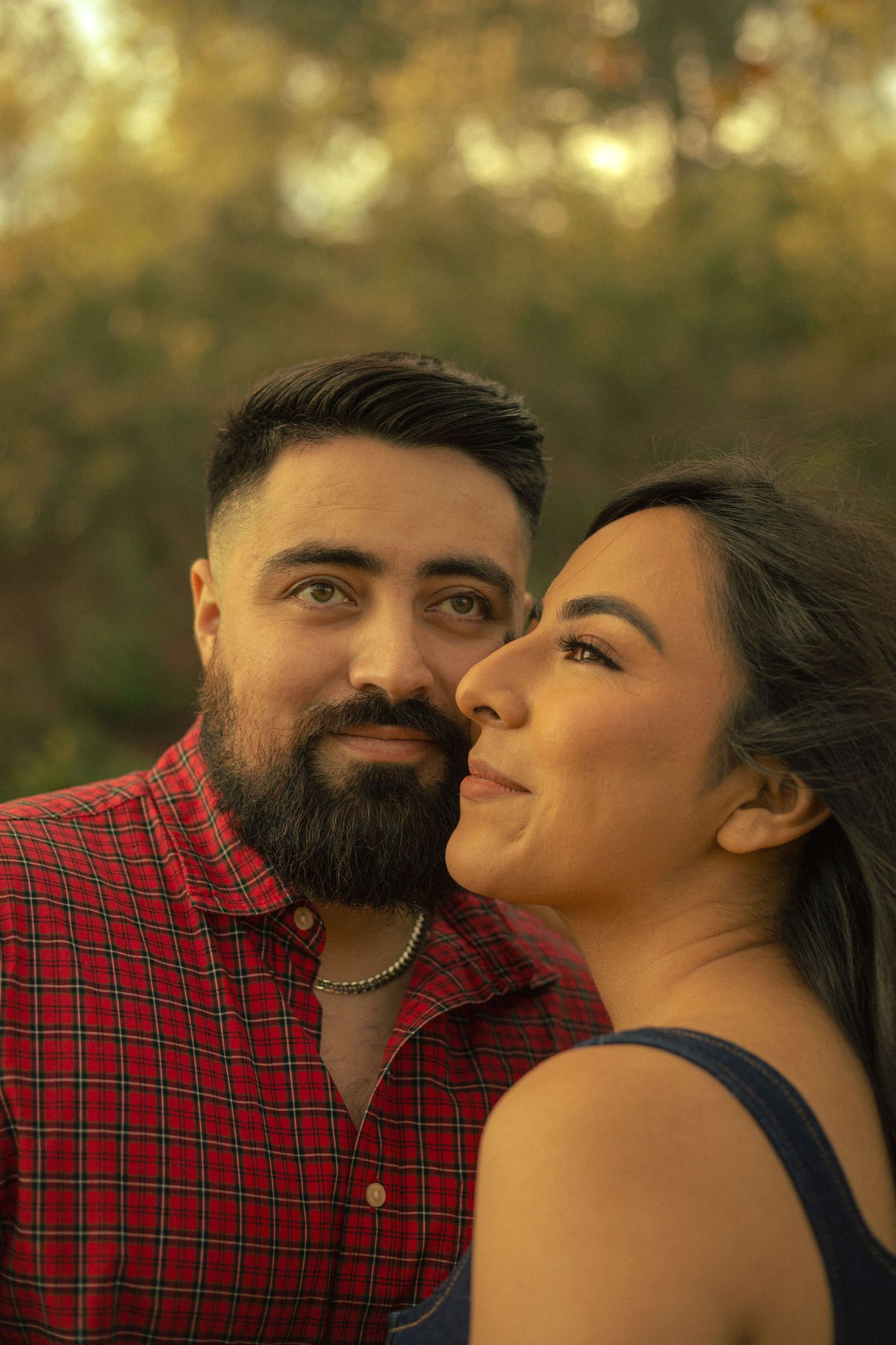 A cinematic photograph of a couple standing together happily during golden hour in Diamond Bar, California.