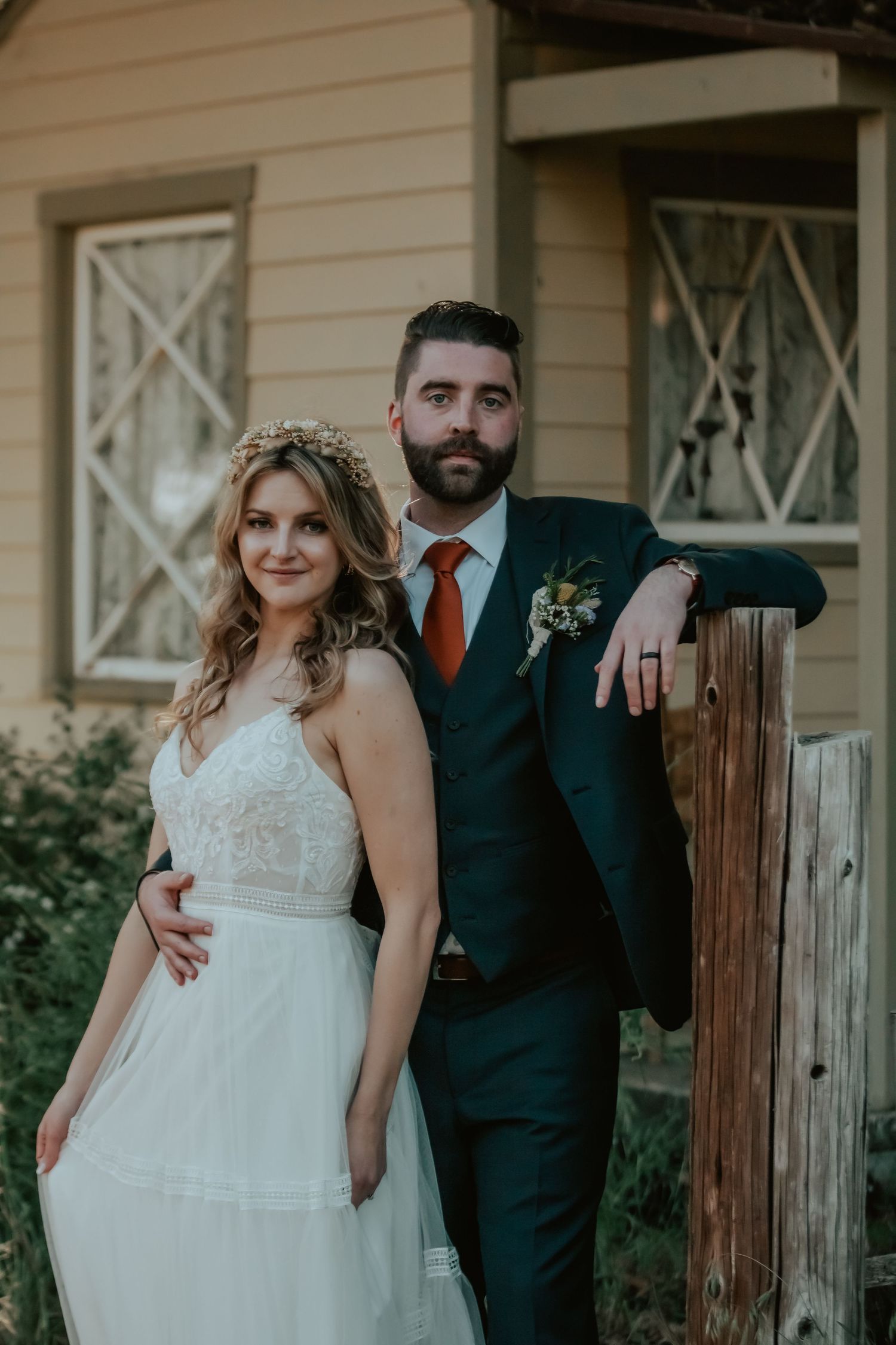 Wedding photography of Bride and Groom posing vogue like in front of a vintage home in Oak Glen California