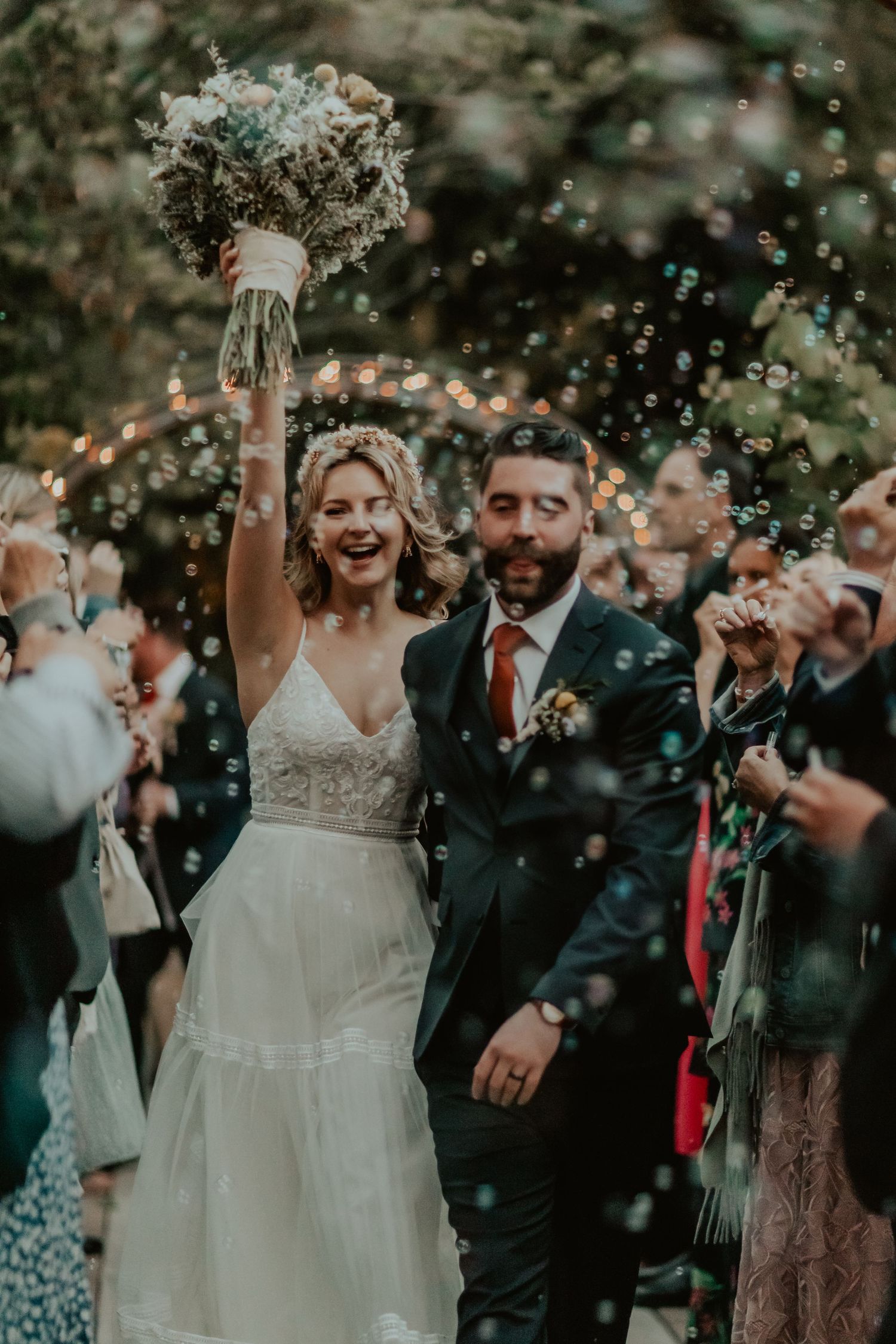 Bride and Groom leaving their Wedding Venue through an elegant bubble exit in Orange County, California