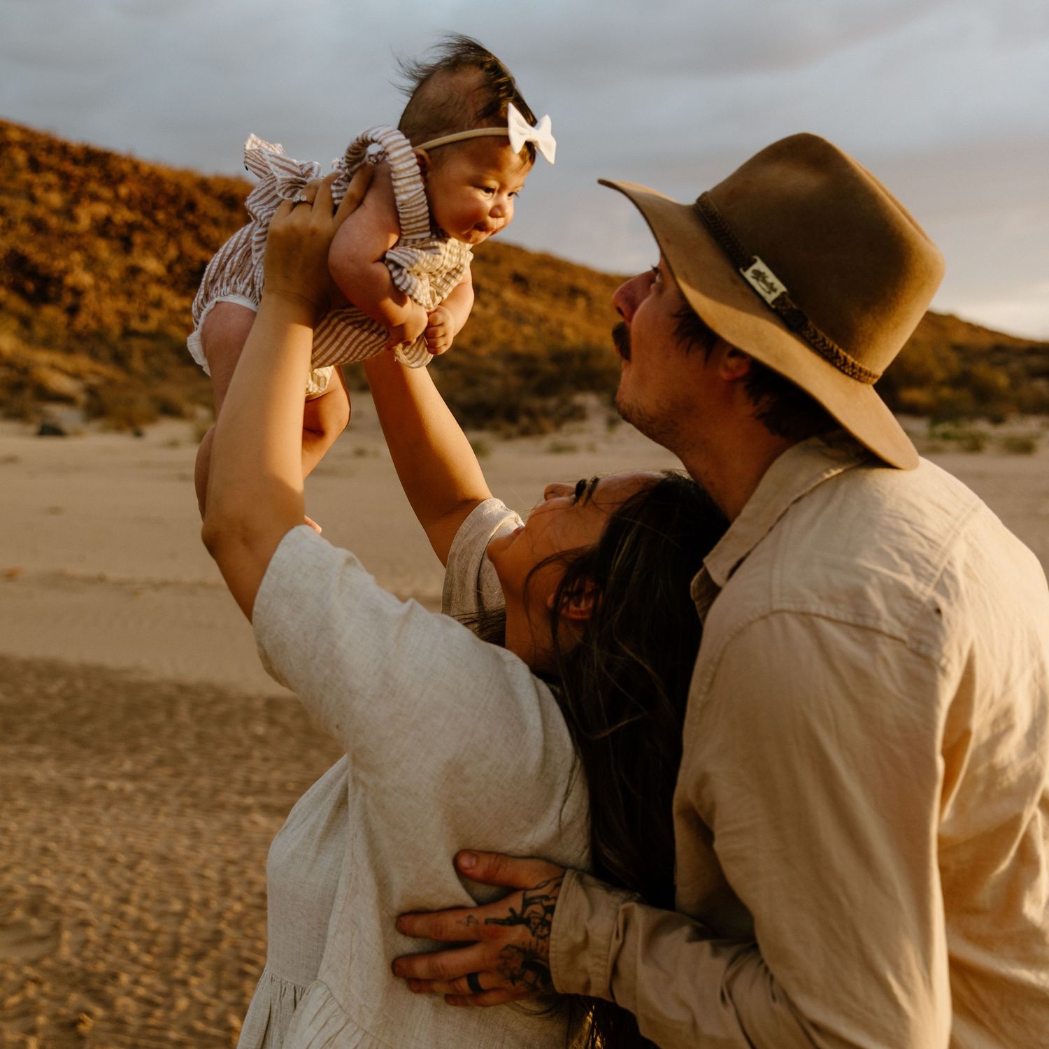 A family newborn photography session, on the beach in Wickham at sunset, WA