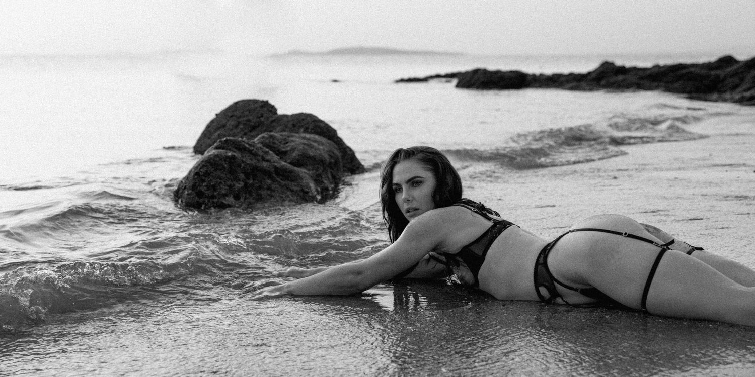 A boudoir photography session on the beach at sunrise in Point Samson