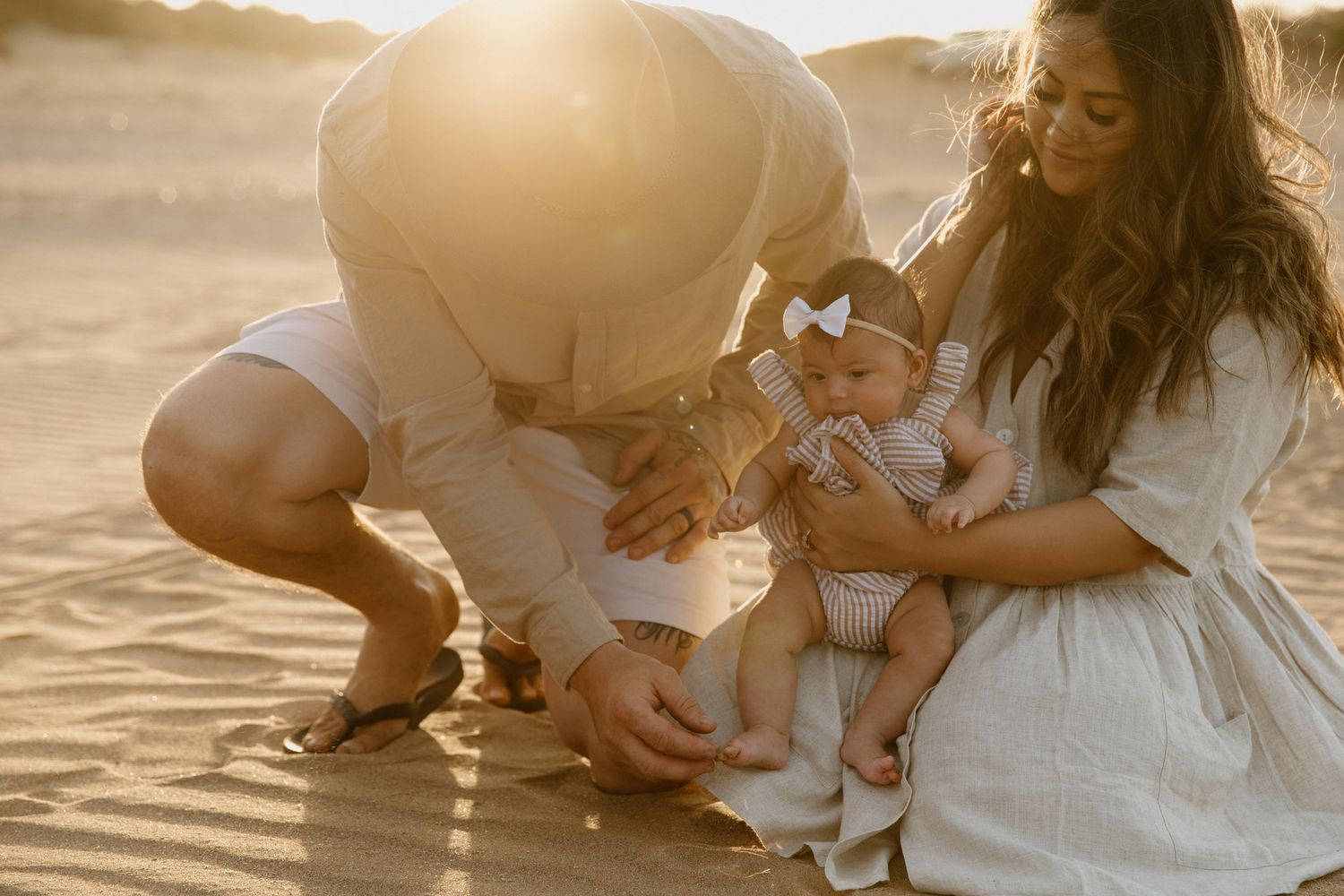 An intimate family moment during a family photography session on the beach in Karratha, WA