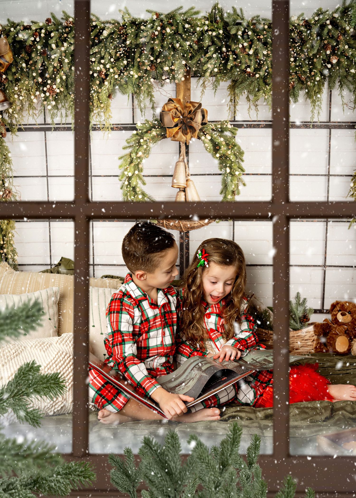 A cozy rustic Christmas scene with plaid flannel, evergreen decorations, and twinkling lights in a window frame setting.